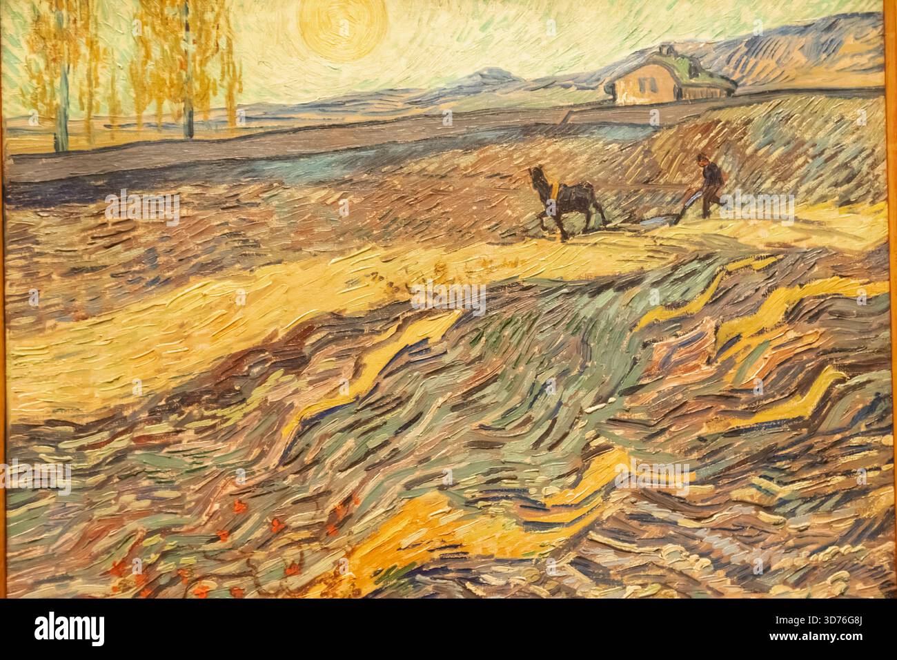 Gemälde mit dem Titel „Landschaft mit Pflugmann“ von Vincent Van-Gogh aus dem Jahr 1889 Stockfoto