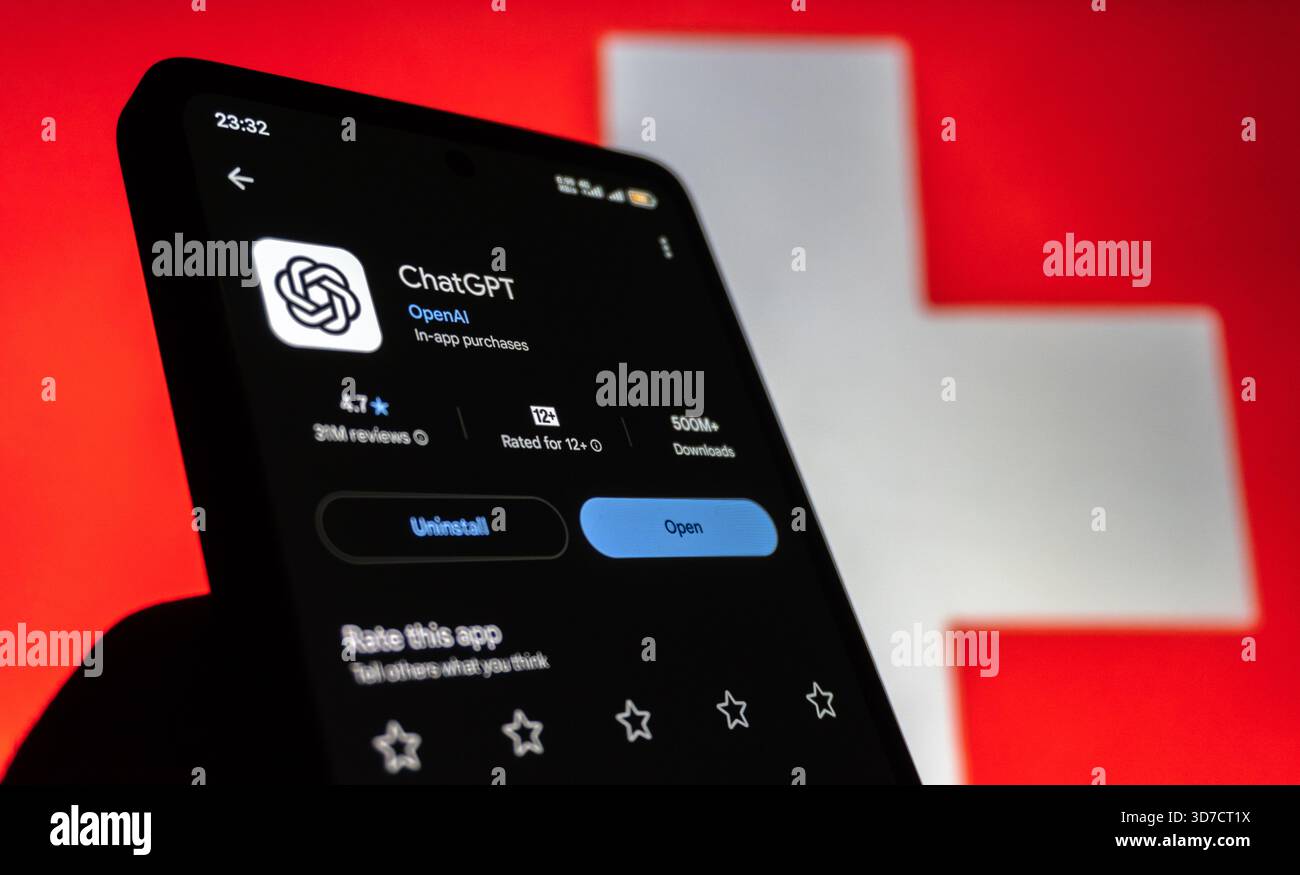ChatGPT App auf Smartphone vor der Flagge der Schweiz. Baku, Aserbaidschan. 11.25.2025. Stockfoto