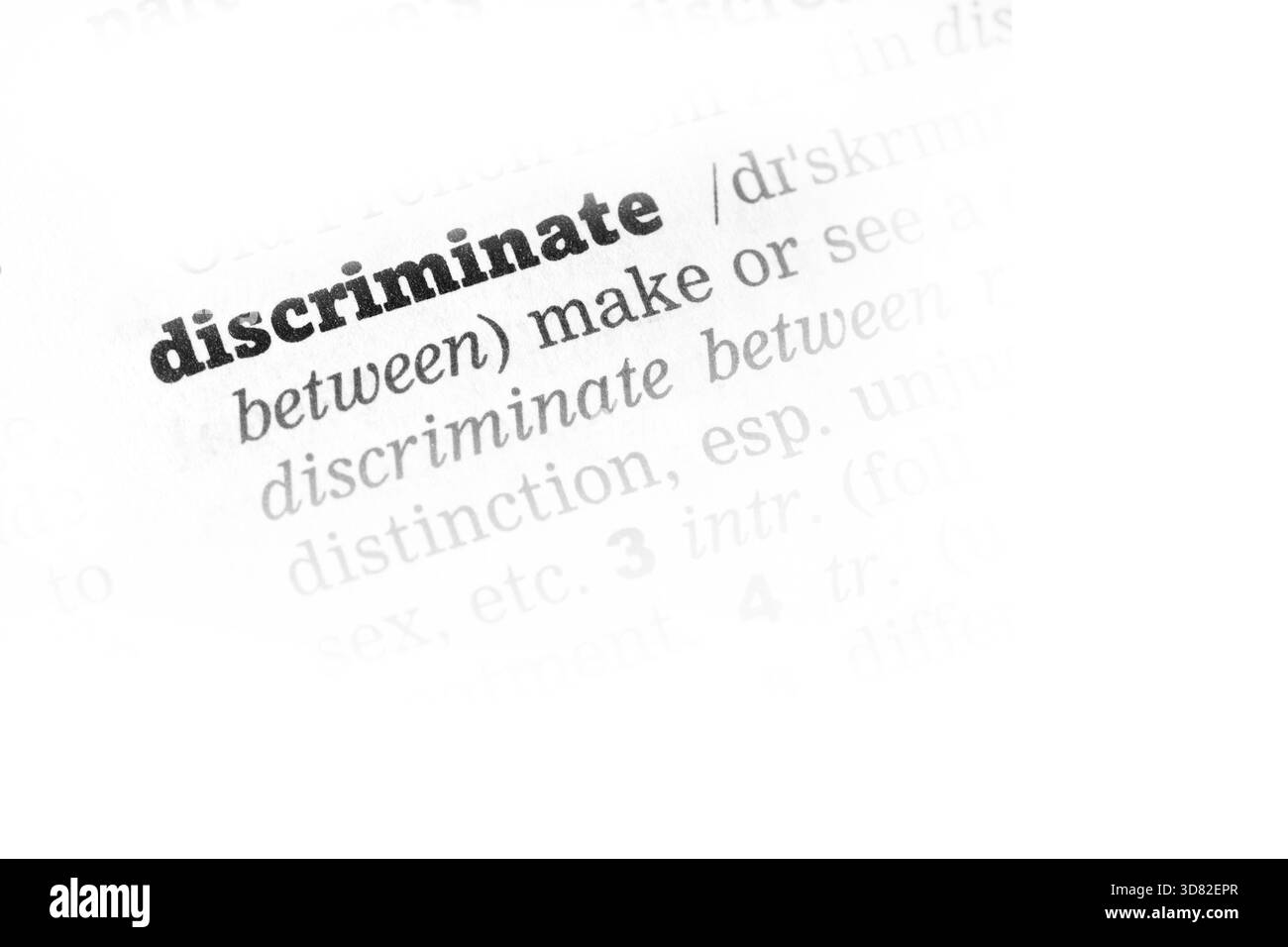 Diskriminieren Wörterbuchdefinition Einzelwort mit soft focus Stockfoto
