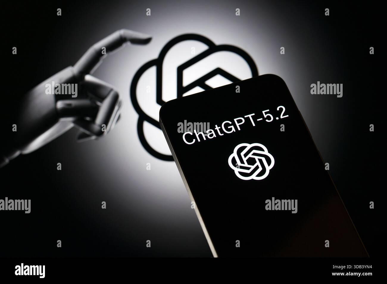 Brüssel, Belgien Dezember 2025. Das OpenAI-Symbol wird auf einem Mobiltelefon angezeigt, wobei das Firmenbranding-Symbol im Hintergrund in dieser Fotoabbildung zu sehen ist. Aufgenommen in Brüssel, Belgien, am 13. Dezember 2025. (Jonathan Raa/SIPA USA) *** ausschließlich für redaktionelle Nachrichten *** Credit: SIPA USA/Alamy Live News Stockfoto