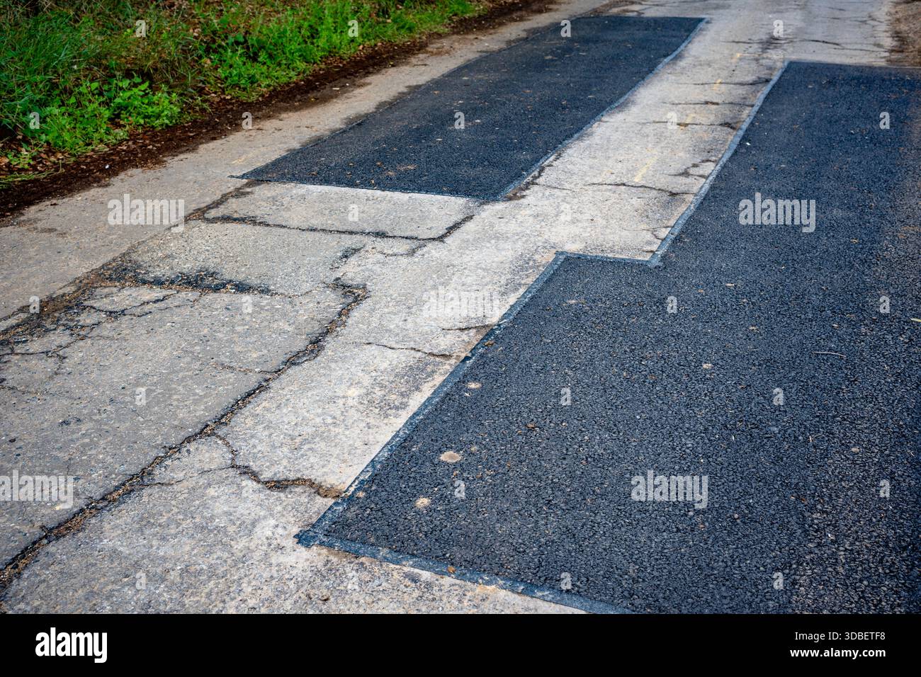 Patchwork Straßenreparaturen Bawdsey Suffolk UK Stockfoto