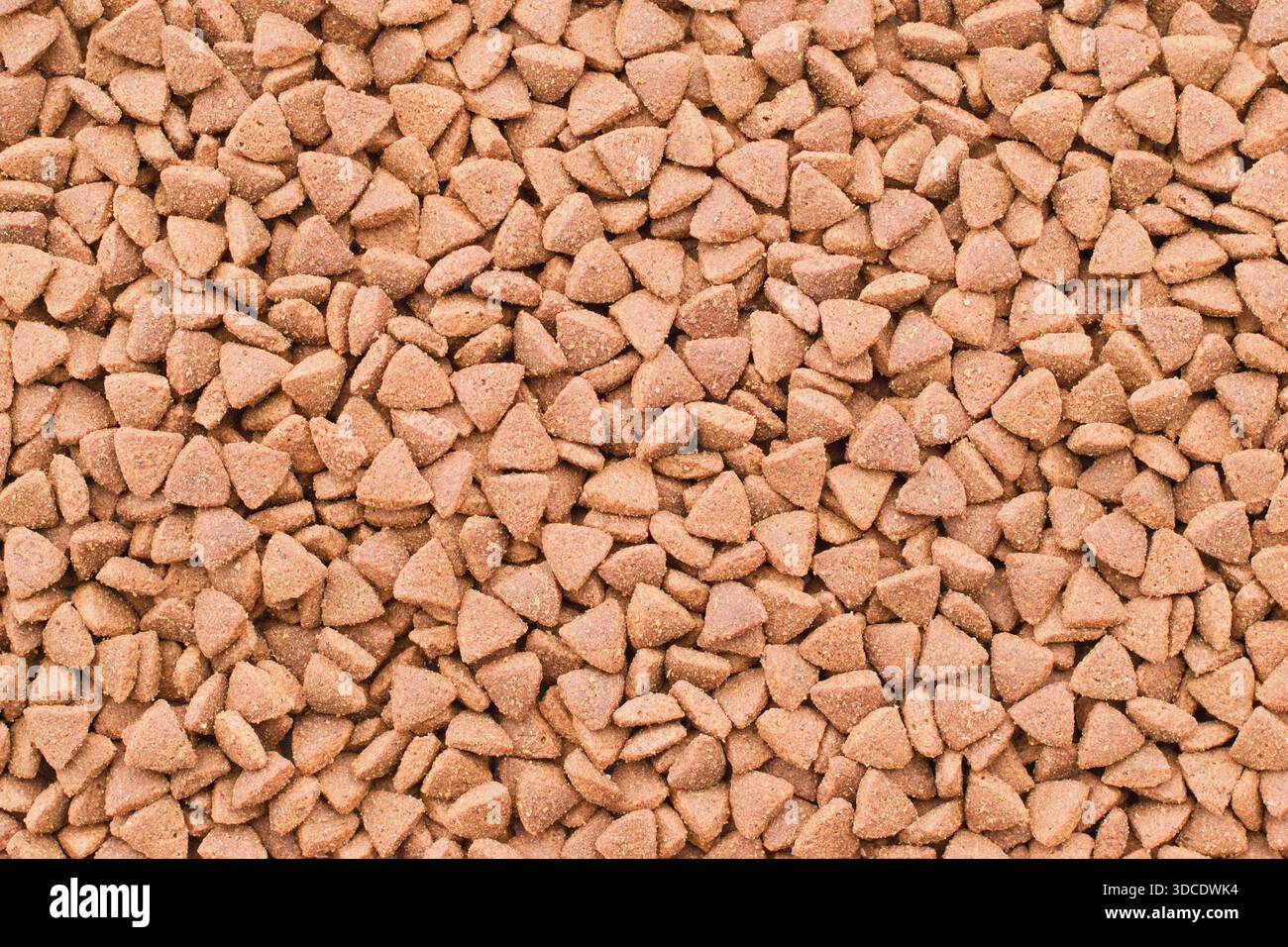 Trockenfutter für Katzen und Hunde - Trockenfutter. Organischer Texturhintergrund Stockfoto