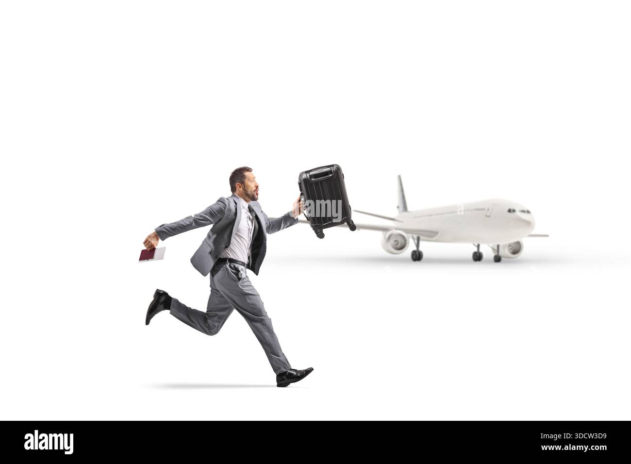 Mann, der zu spät für einen Flug am Flughafen auf weißem Hintergrund läuft Stockfoto