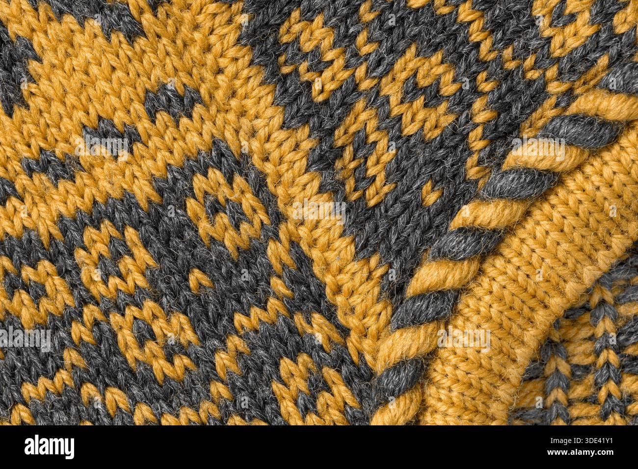 Abstrakte gelbe und schwarze Wollstrick-Details als Hintergrund Stockfoto