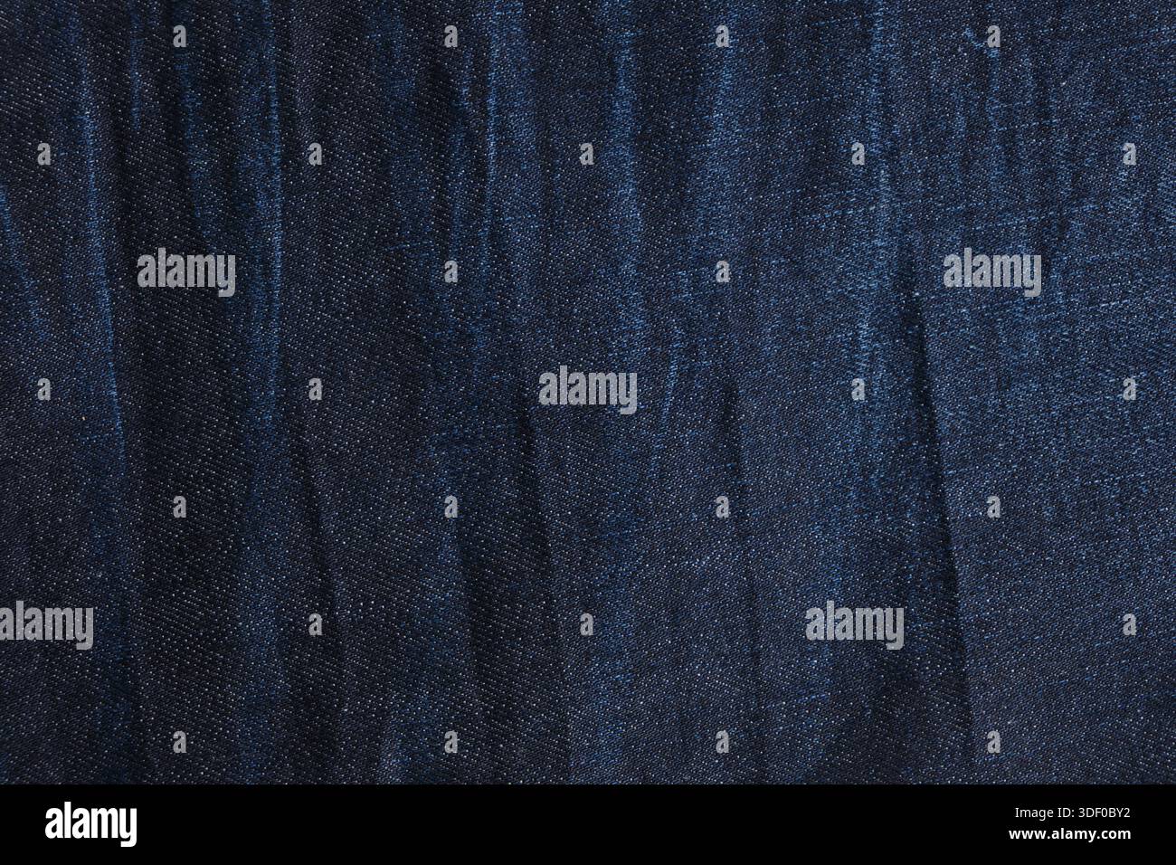 Textur-Denim-Gewebe oder dunkelblauer Hintergrund von Denim-Gewebe Stockfoto