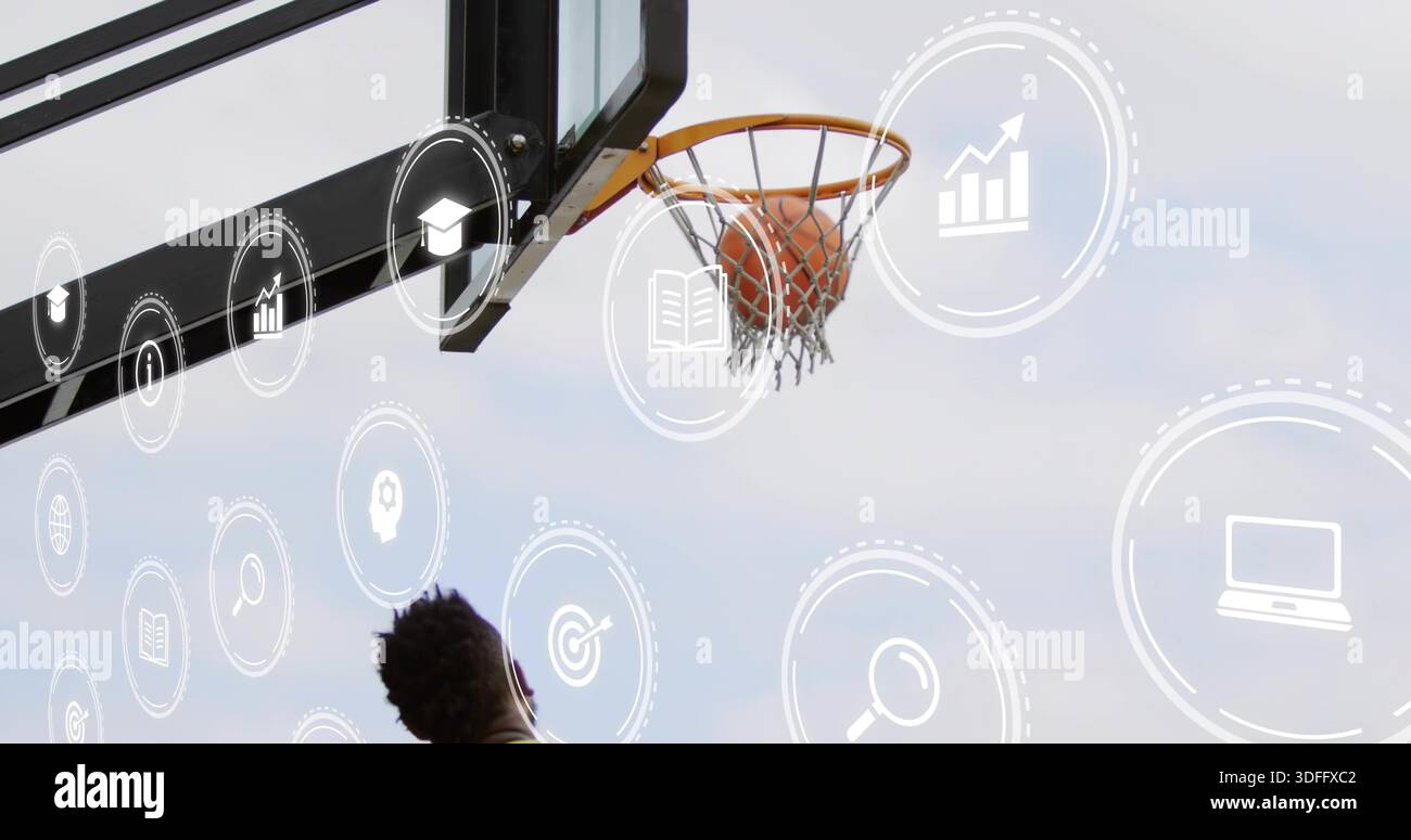 Ein Mann im dunklen Tank greift Basketball, der im Netz am Basketball mit überlagerten Ikonen gefangen ist Stockfoto