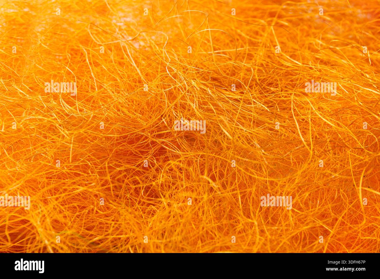 Nahaufnahme mit orangefarbener Filzstruktur aus Wolle Stockfoto