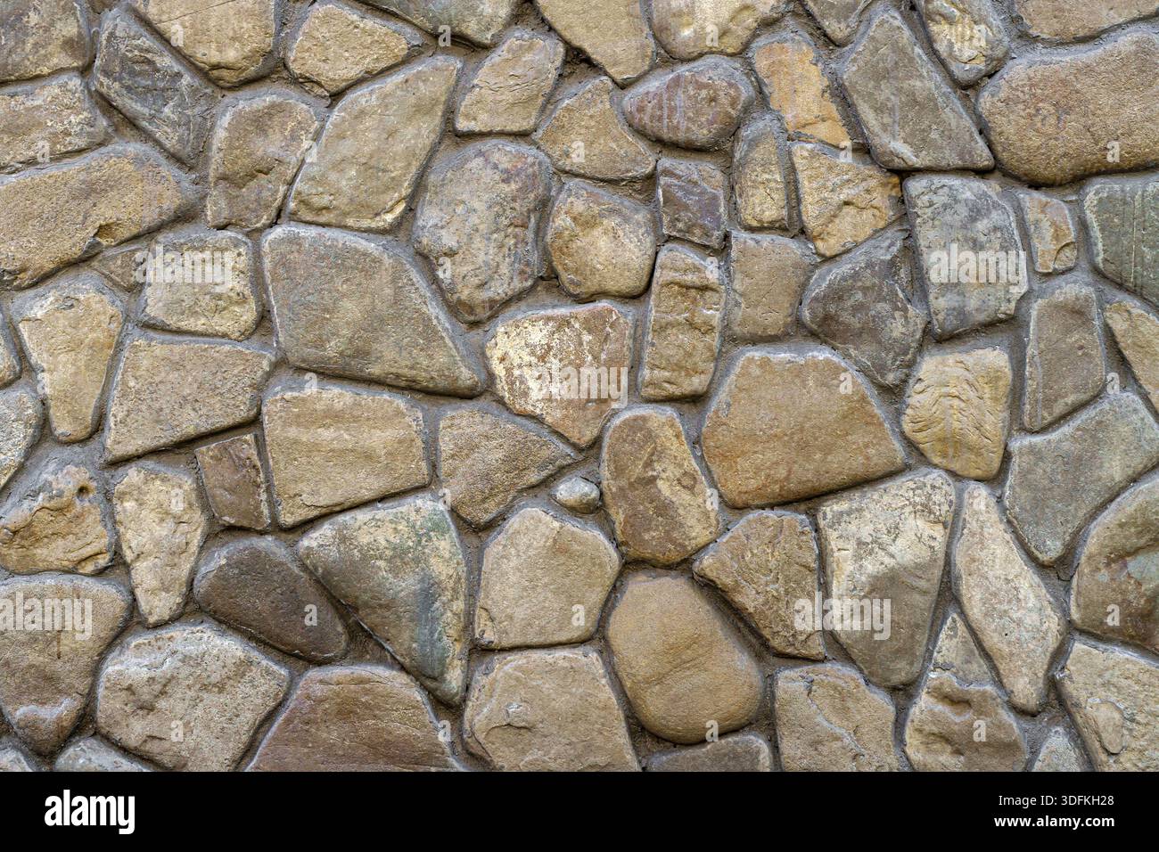 Natursteinmauer. Abstrakter natürlicher Hintergrund. Stockfoto
