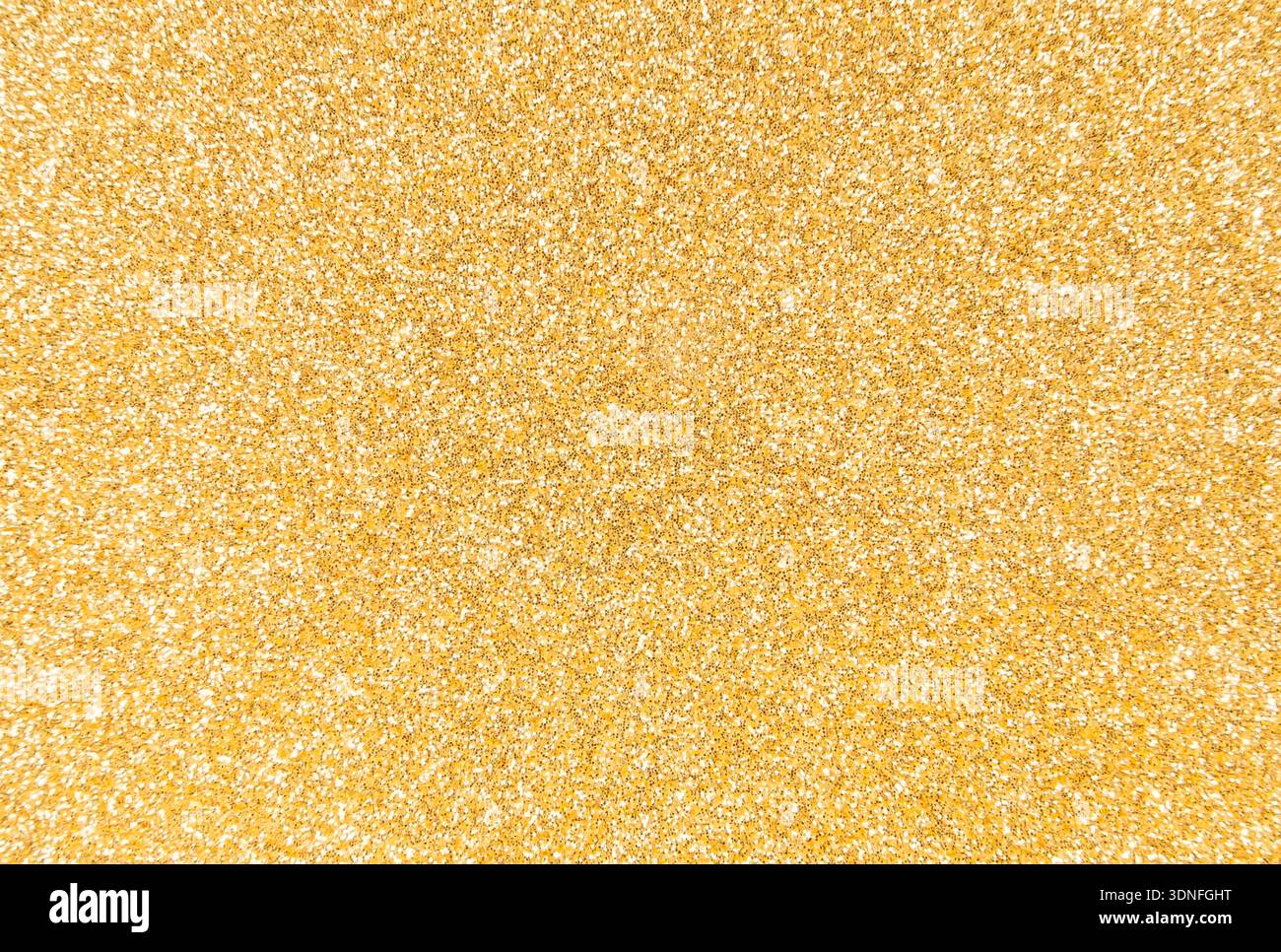 Hintergrund mit goldenem Glitzer und Pailletten Stockfoto