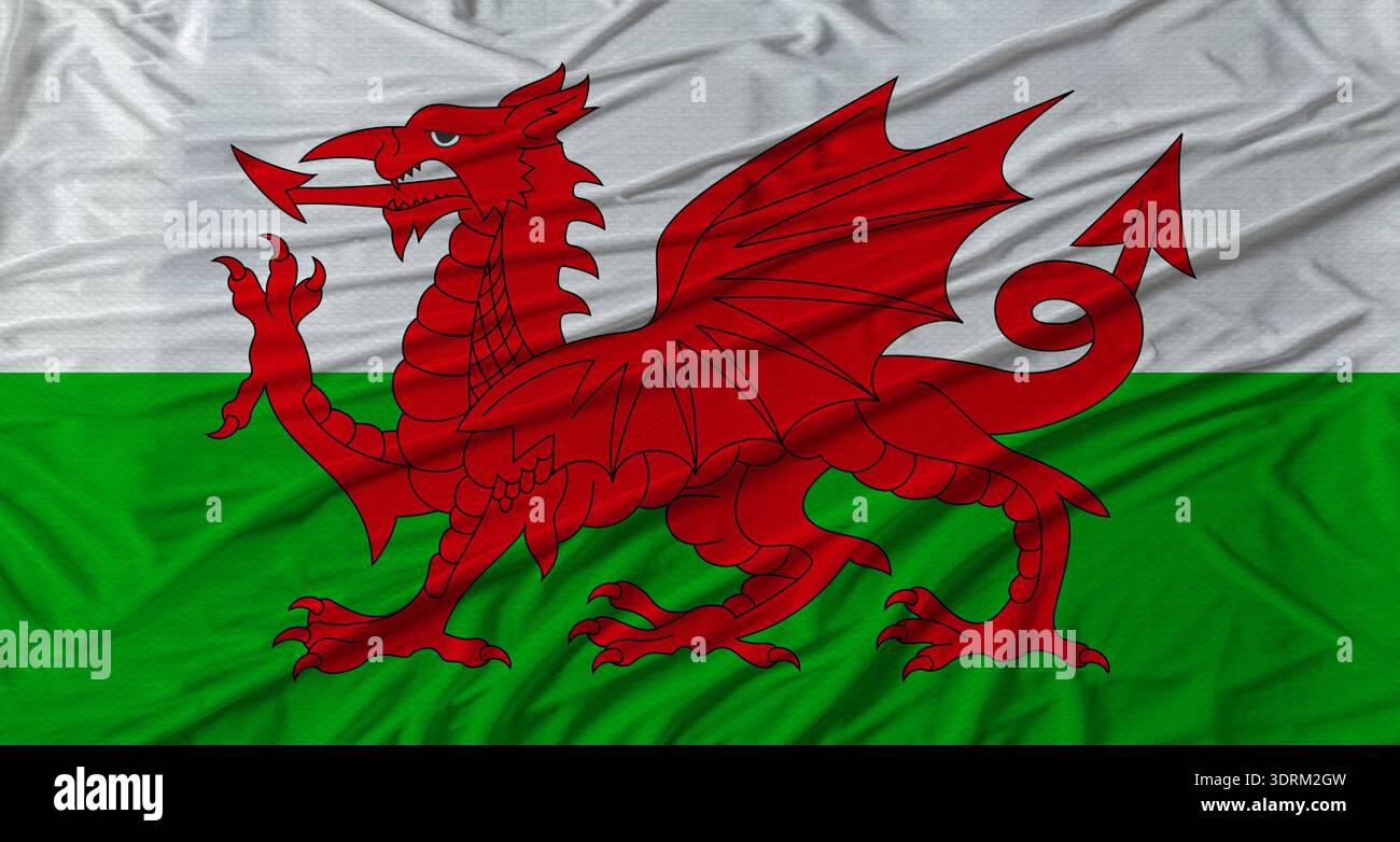 Walisische Flagge schwenkt. Flagge von Wales mit Stoffstruktur Stockfoto