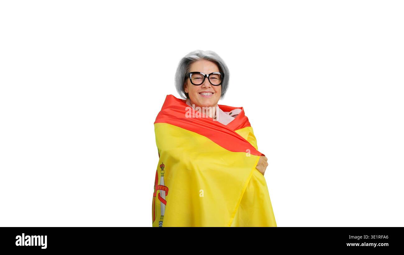 Eine ältere Frau lächelt in Spanien-Flagge Stockfoto