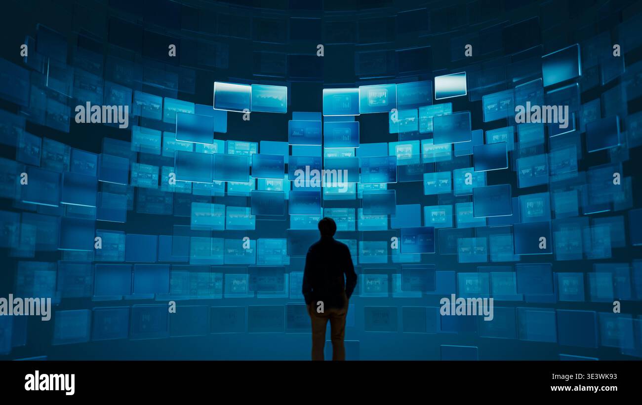 Ein Mann steht in der Silhouette und betrachtet viele digitale Bildschirme, die verschiedene Grafiken und Daten anzeigen. Die Einstellung ist dunkel und konzentriert sich auf die Bildschirme. Stockfoto