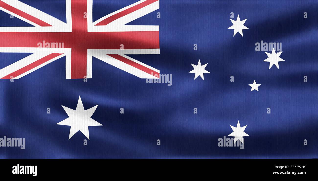 Die australische Flagge weht mit dem Union Jack und sechs weißen Sternen vor einem leuchtend blauen Hintergrund, die Nationalstolz und Identität symbolisieren Stockfoto