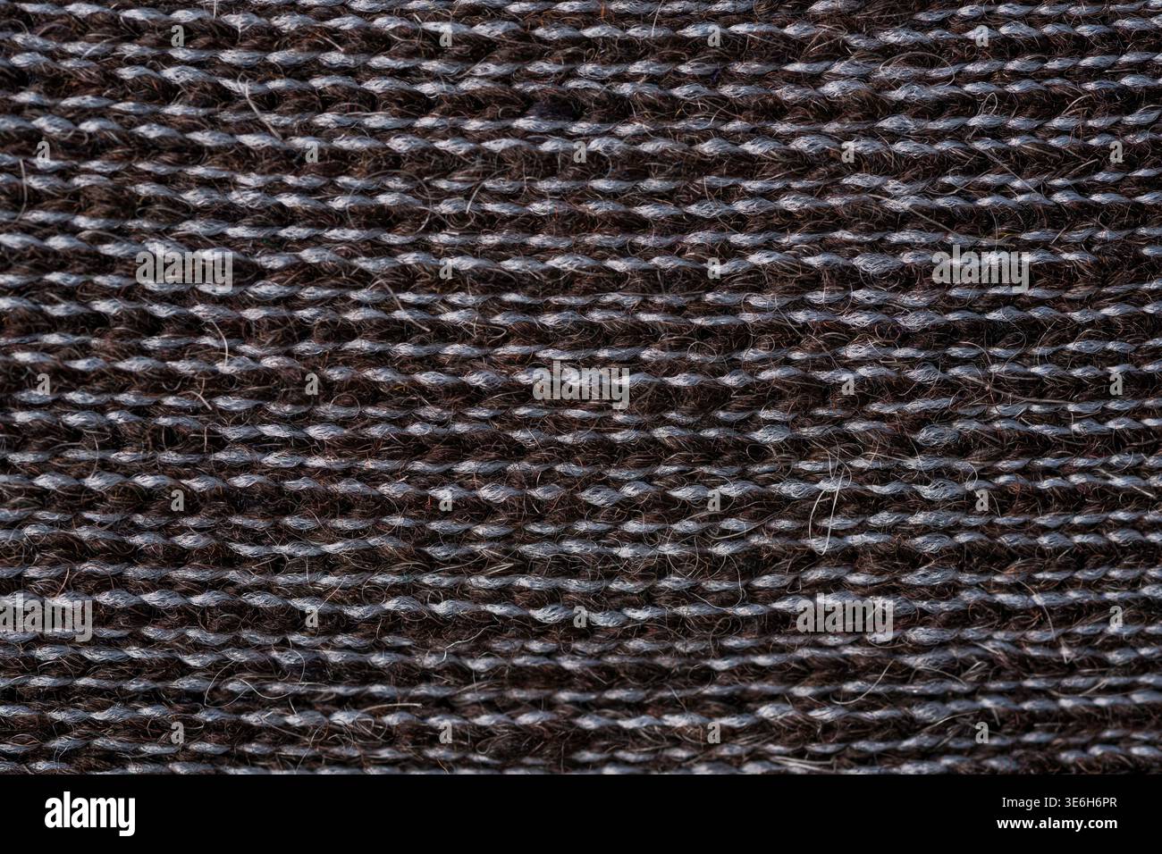 Dunkle Alpakawolle gestrickt Textil Makrostruktur Naturfaser Hintergrund Stockfoto