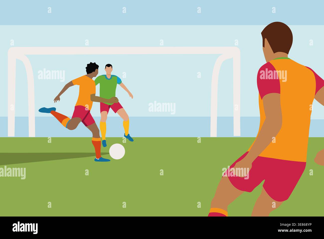 Zwei Spieler treten auf einem Fußballfeld an der Küste an. Ein Spieler in Orange tritt den Ball, während ein anderer in Grün verteidigt. Ein zusätzlicher Player sieht f Stockfoto