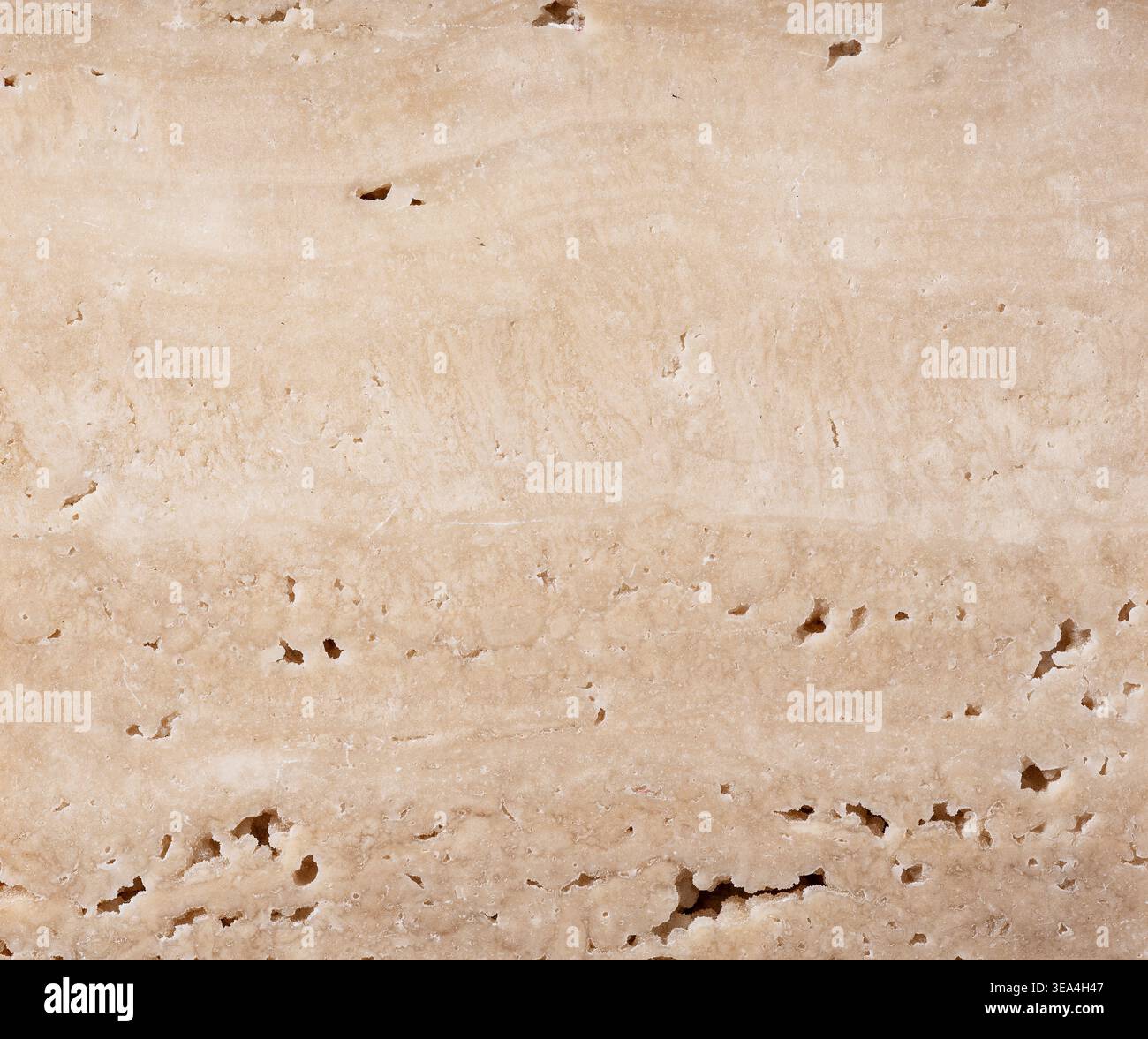 Hochauflösender beiger Travertinstein Texturhintergrund, poröse natürliche Kalksteinoberfläche Stockfoto