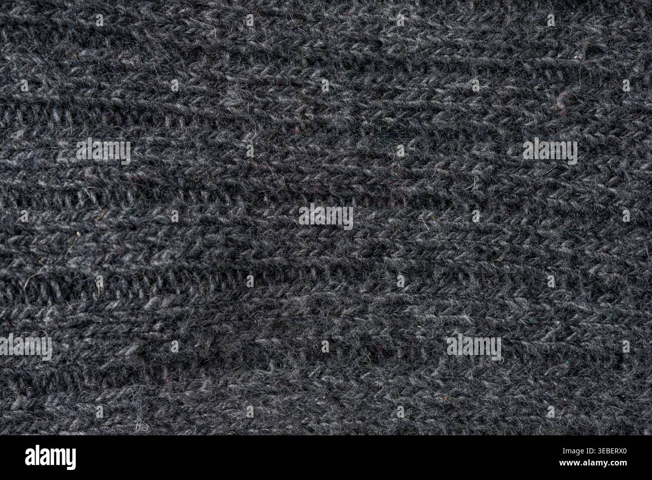 Dunkler Texturhintergrund für Textilindustrie und Materialdetails Stockfoto