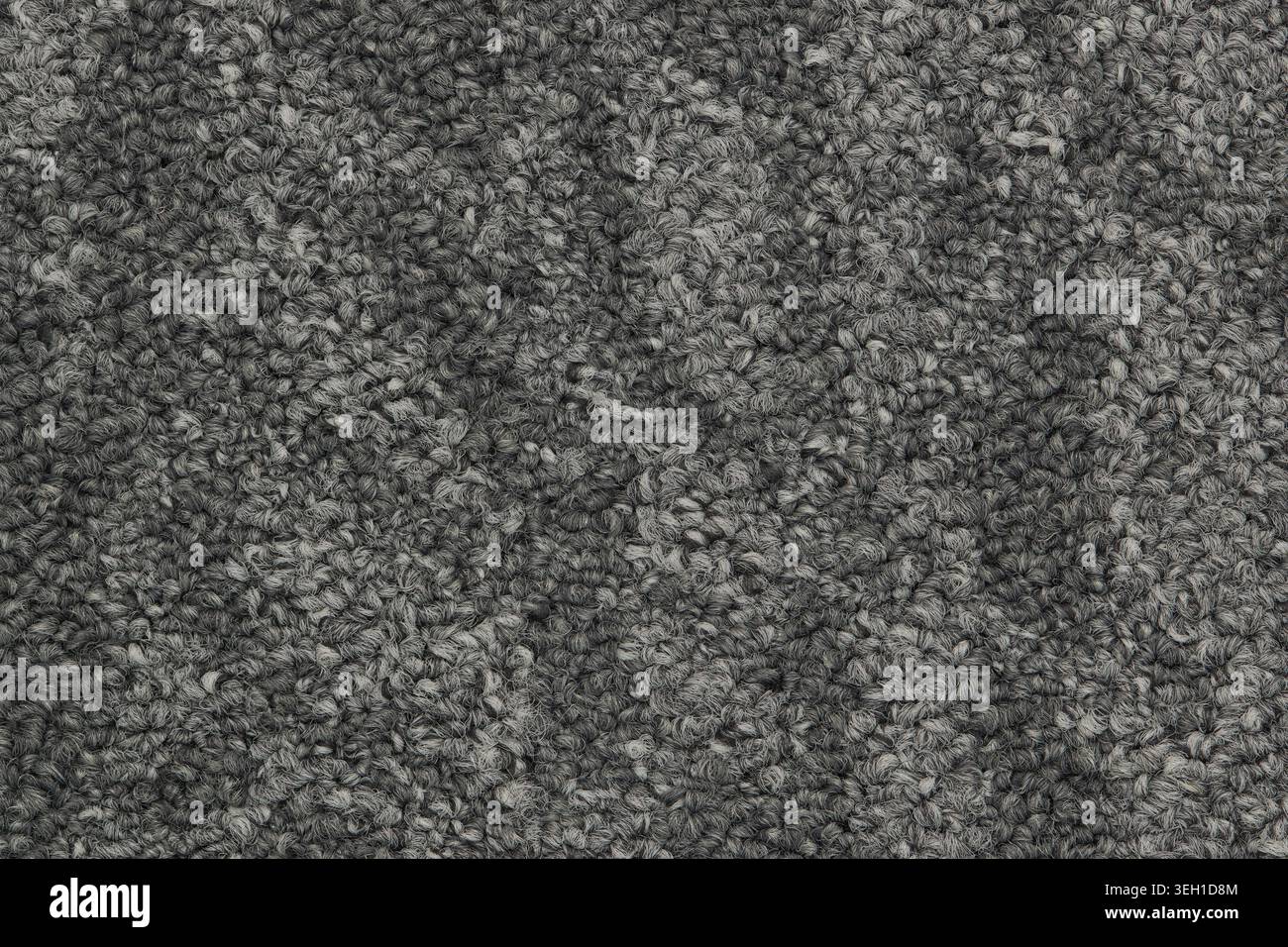 Grauer Teppich zweifarbige Farbmuster Muster Nahaufnahme Details. Stockfoto