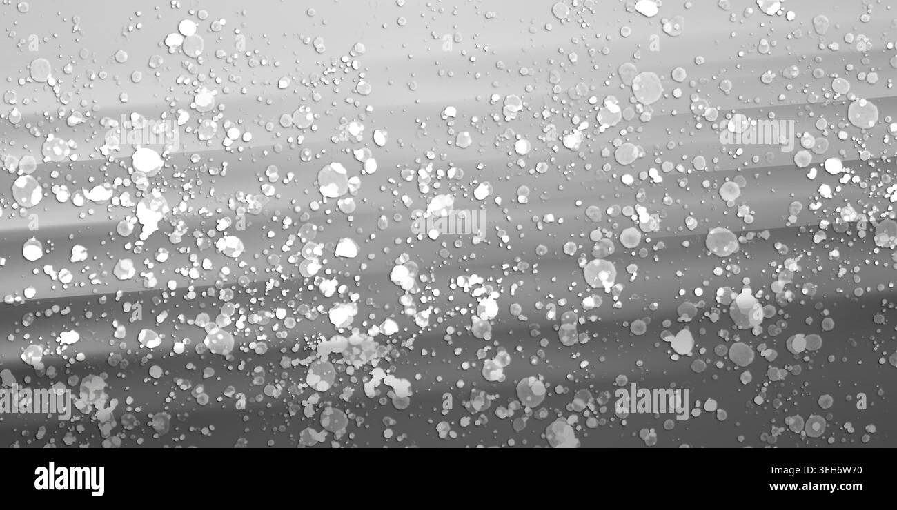 Ein künstlerischer abstrakter Hintergrund mit einem glatten, monochromatischen Grauverlauf, überlagert mit verstreuten weißen Farbspritzern und Punkten. Stockfoto