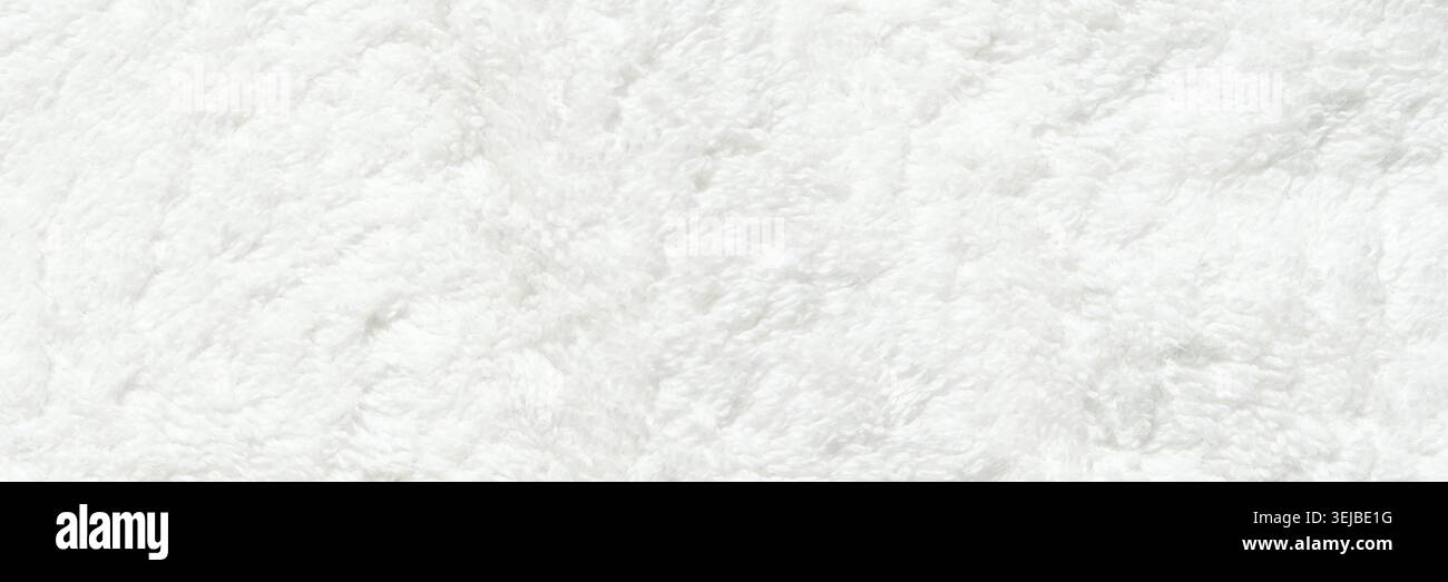 Weiches weißes flauschiges Handtuch Textur Hintergrund mit Plüschstoff Detail Stockfoto