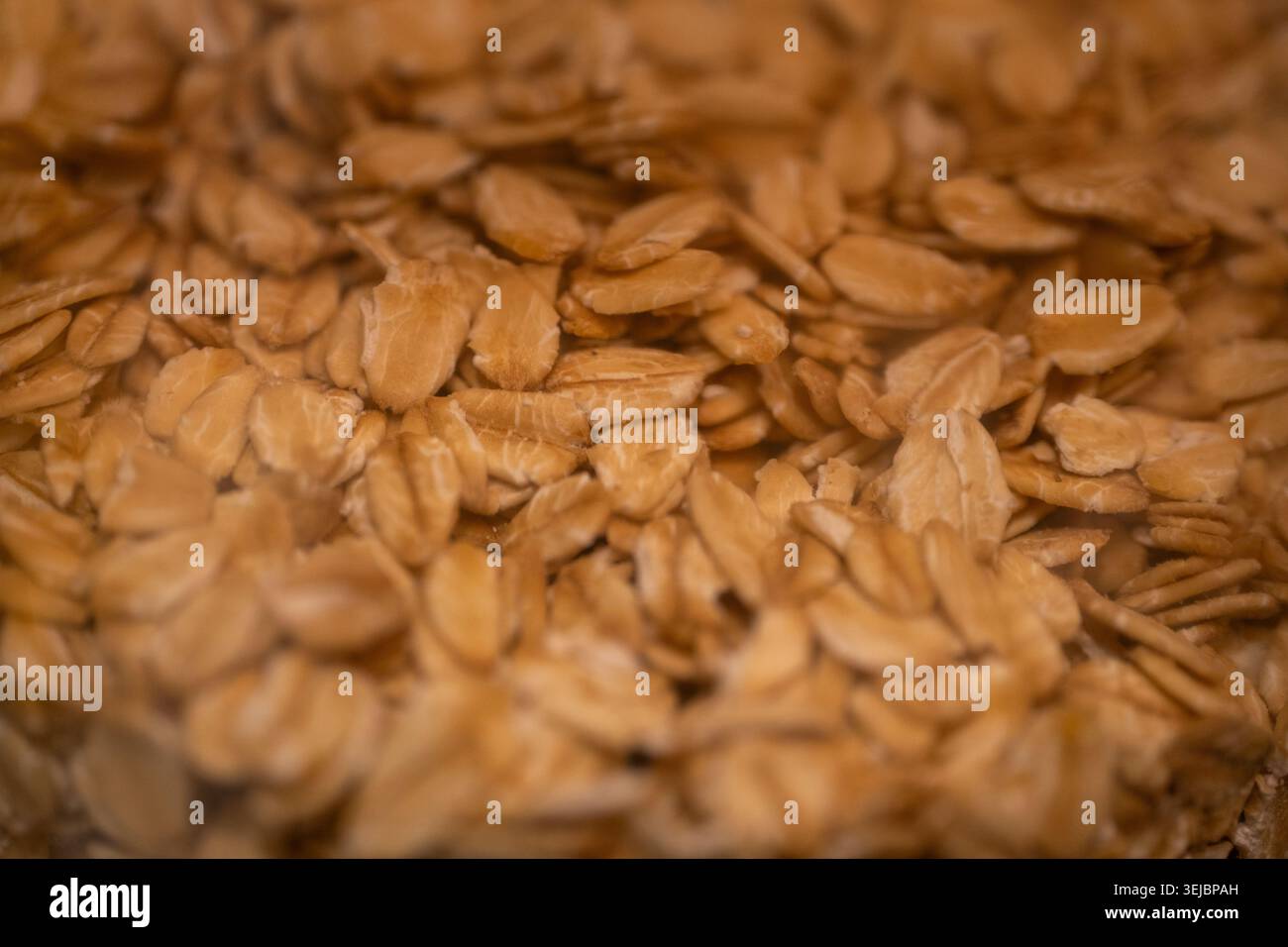 Nahaufnahme Haferflocken Textur für gesunde Ernährung und Bio-Lebensmittel Hintergrund Stockfoto