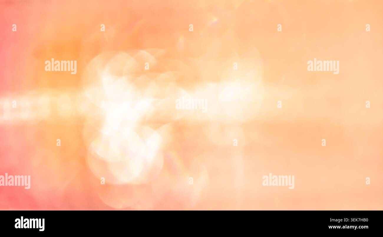 Lebendiges abstraktes Licht Bokeh in warmen Orange- und Pink-Tönen für modernes Design Stockfoto