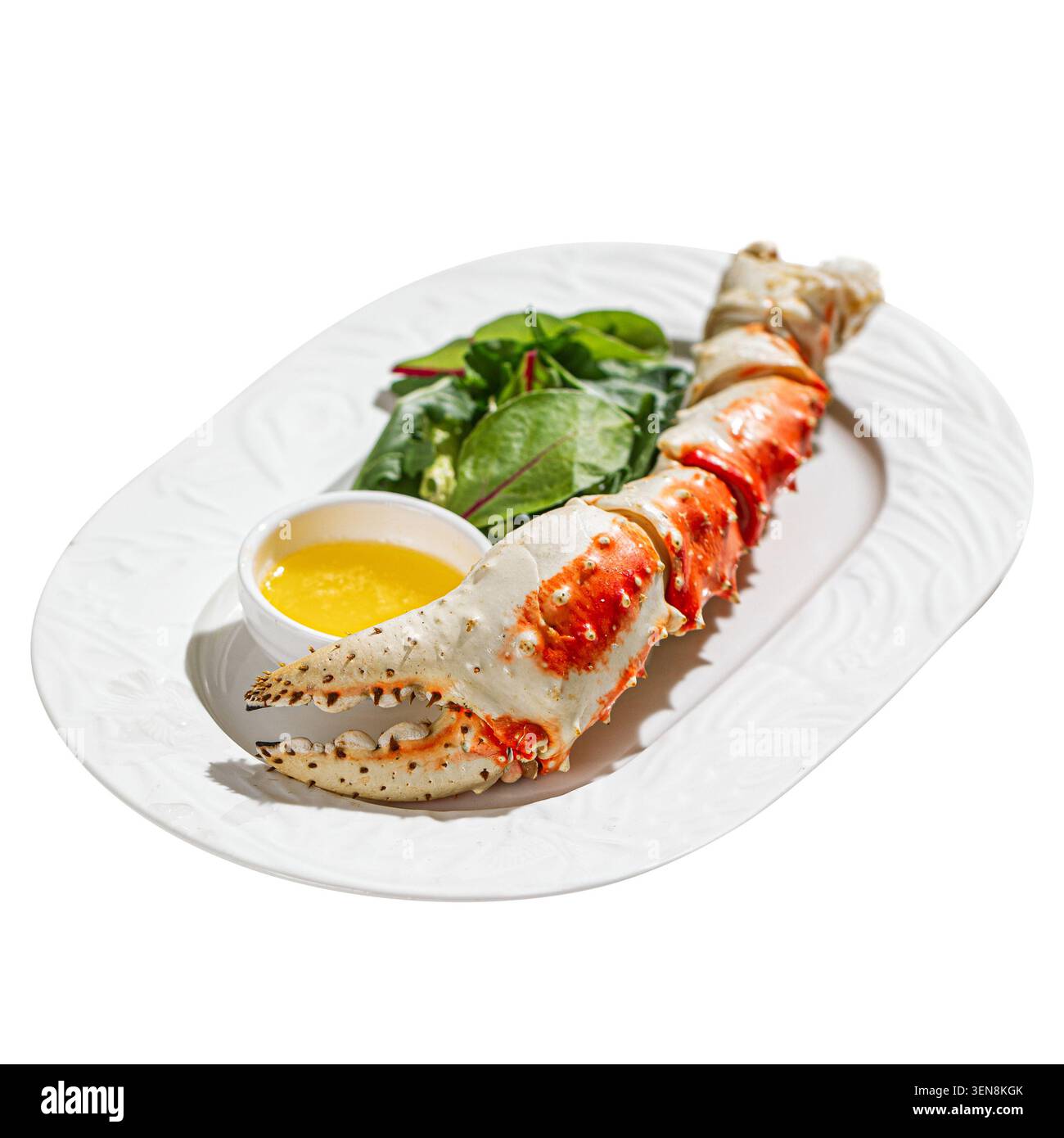Königskrabbenschenkel mit Gemüse und Buttersauce Stockfoto