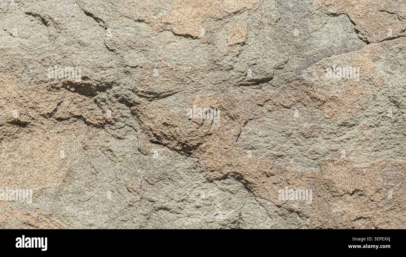 Raue Steinoberfläche mit natürlicher Textur und geologischen Details Stockfoto