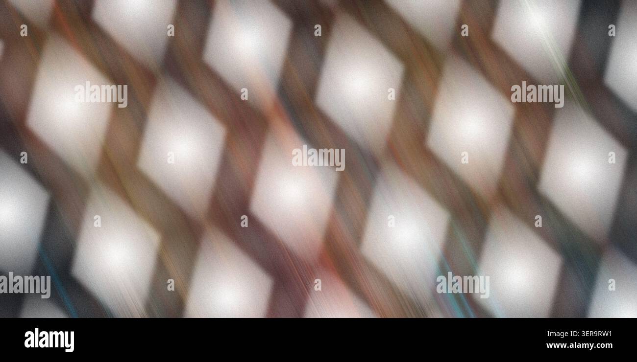 Ein abstrakter Hintergrund mit einem sich wiederholenden Muster aus leuchtenden, weichen Diamantformen mit einer warmen, strukturierten und bewegungsunscharfen Ästhetik. Stockfoto