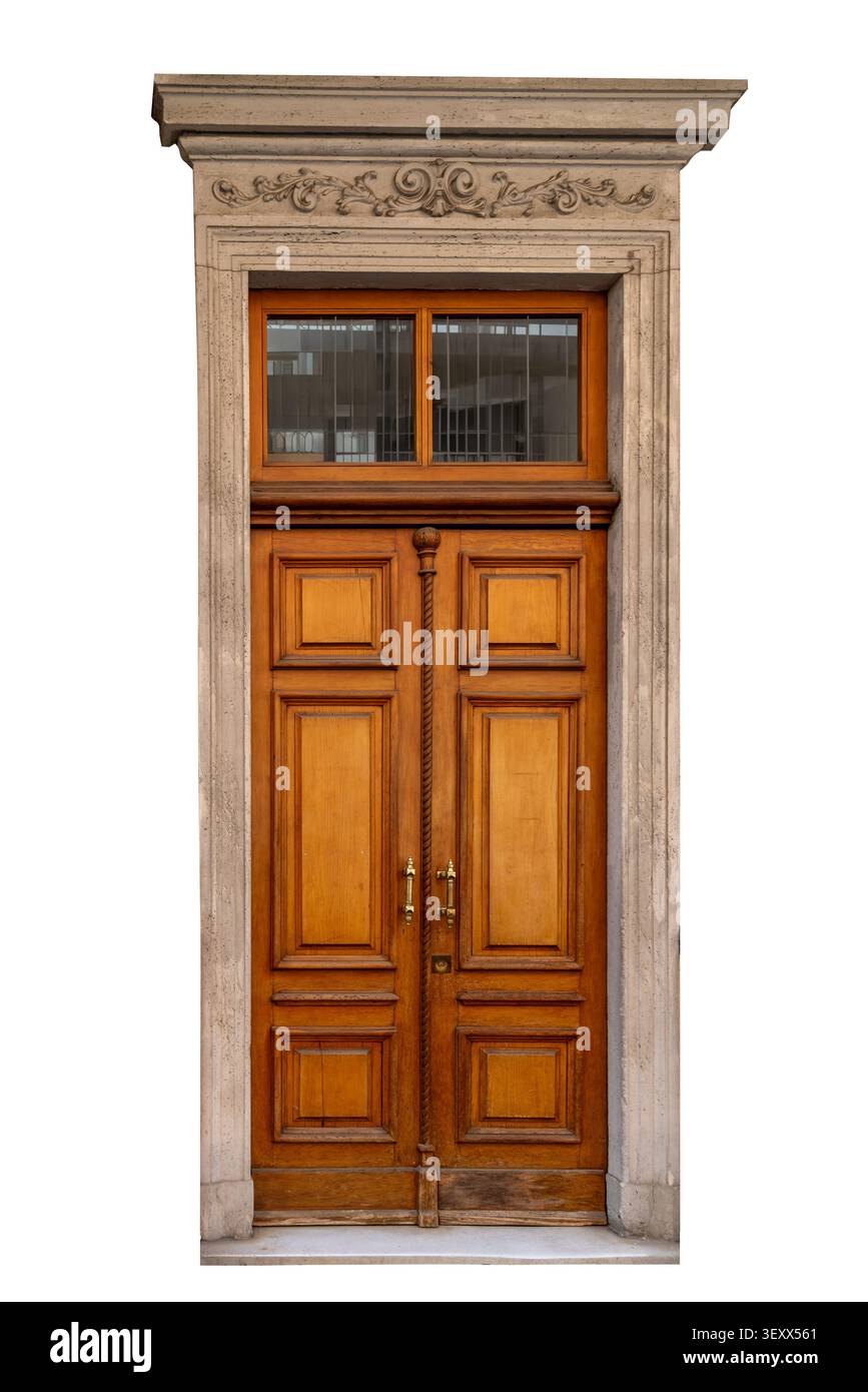 Elegante antike Doppeltür aus poliertem Holz, mit dekorativem Steinrahmen mit Reliefschnitzereien und Glasspießfenster. Luxus pro Stockfoto