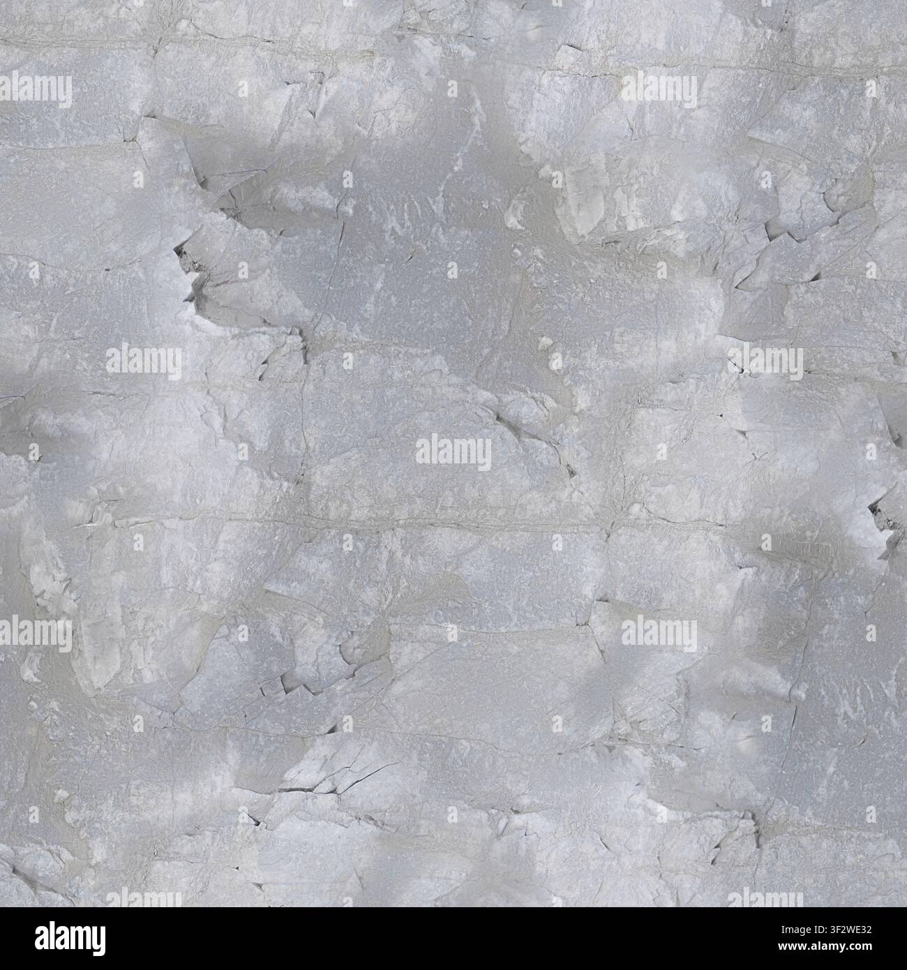 Eine helle, licht-silbergraue, zerklüftete Kalksteinklippe mit kunstvollen Spalten und verwitterten geologischen Rissen. Stockfoto