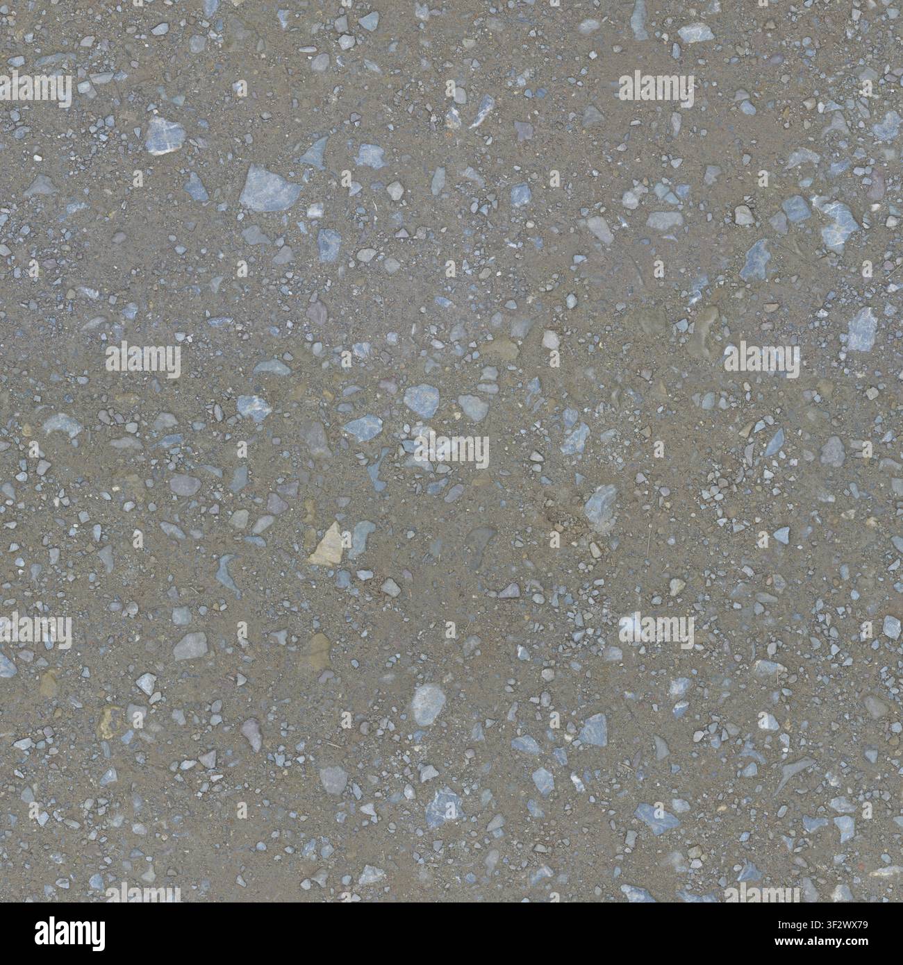 Eine hochdetaillierte Ansicht von oben einer nassen, felsigen Kiesoberfläche, die unterschiedliche Steingrößen und Mineraltexturen hervorhebt. Stockfoto