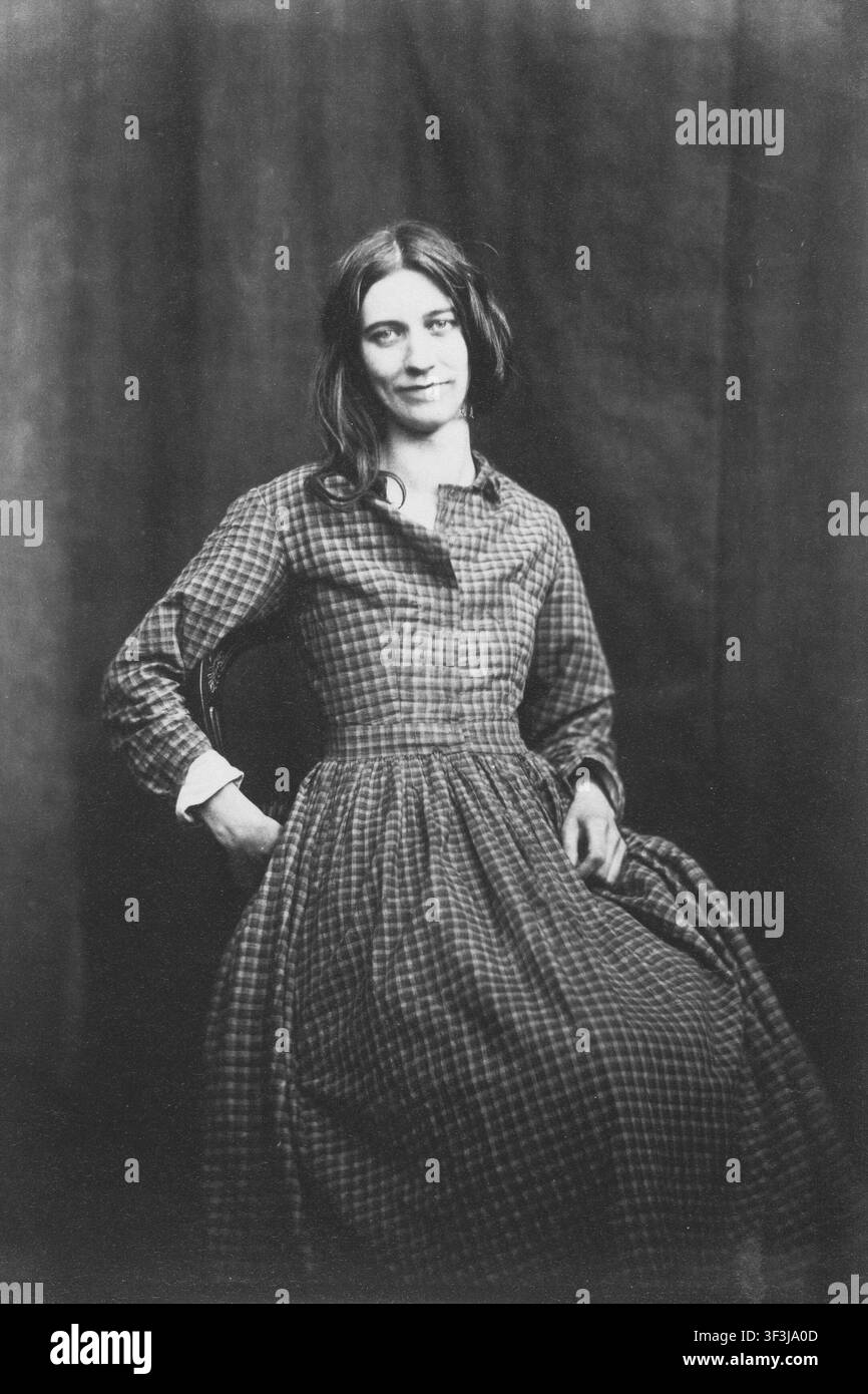 Eine nicht identifizierte Patientin sitzt auf einem Stuhl in dem Foto Patient, Surrey County Lunatic Asylum aus den 1850er Jahren von dem bahnbrechenden britischen Psychiater und Fotografen Dr. Hugh Welch Diamond (1808–1886). Diamond war der Leiter der Frauenabteilung im Asyl und nutzte Fotografie als objektives klinisches Werkzeug zur Diagnose. Diese historische Arbeit stellt eine der frühesten systematischen Anwendungen der fotografischen Physiognomie im Bereich der psychiatrischen Medizin dar. Stockfoto
