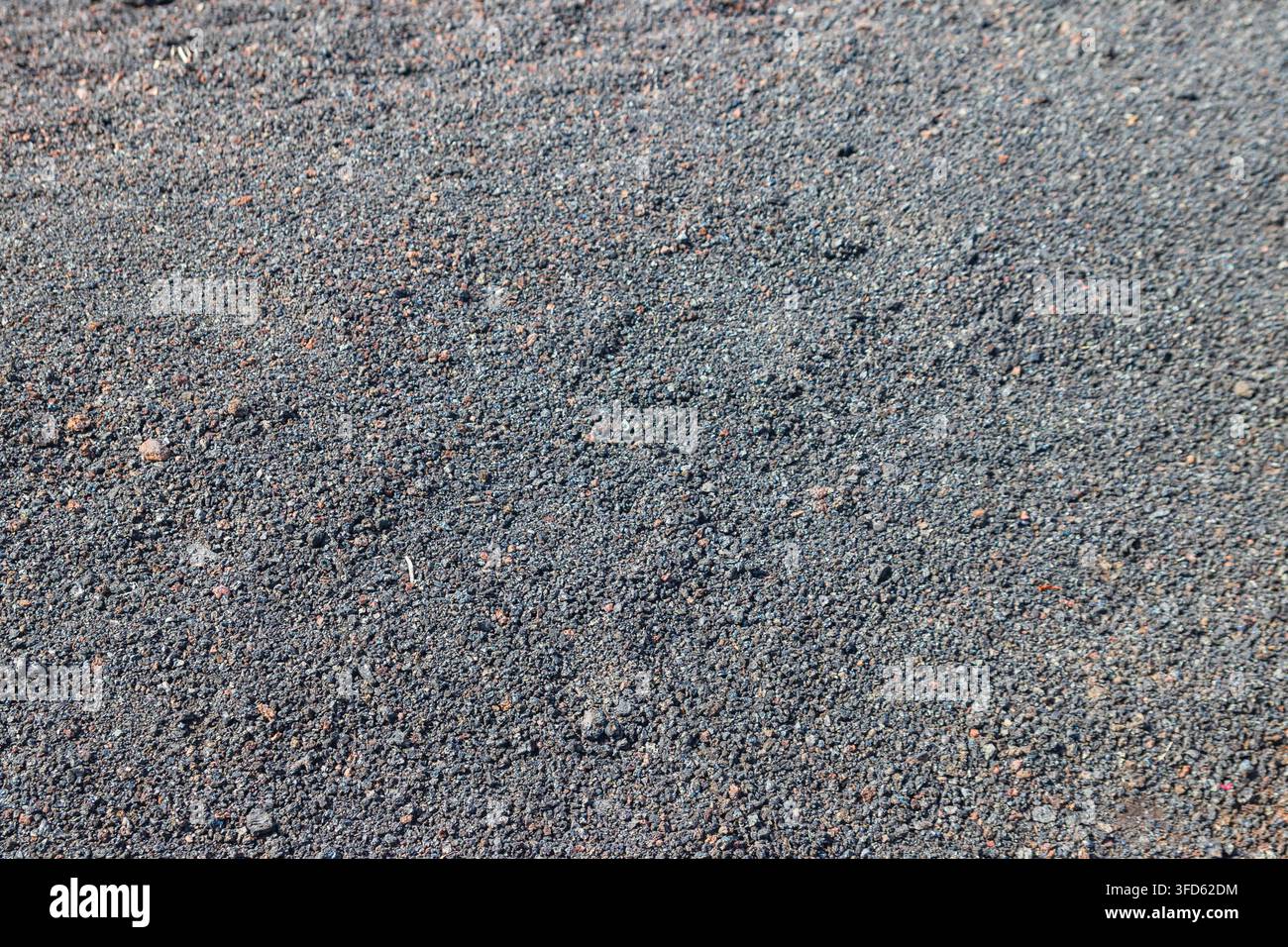 Vollformat-Texturhintergrund aus schwarzer Vulkanasche Stockfoto