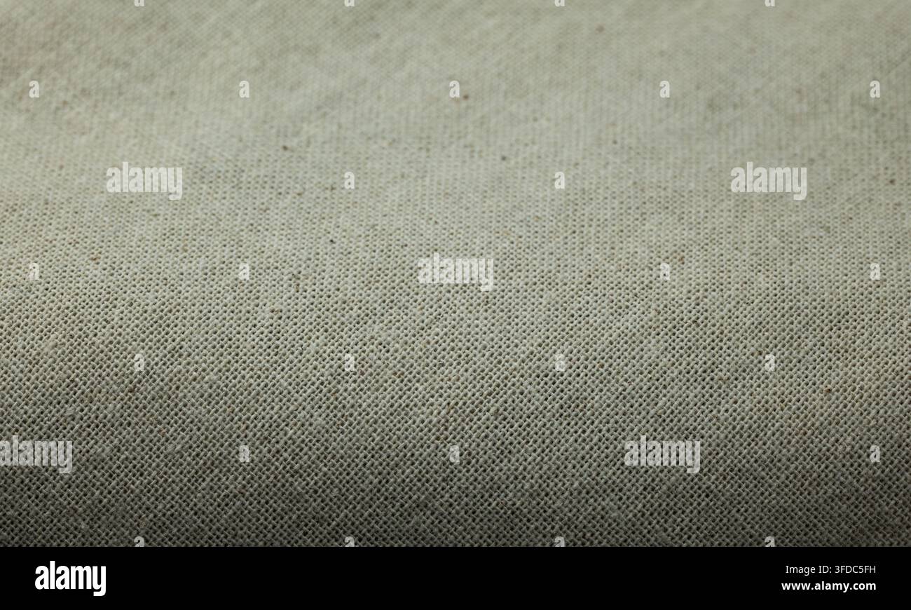 Jute-Stoff, der gewebtes Textilmaterial als texturierter Hintergrund zeigt Stockfoto