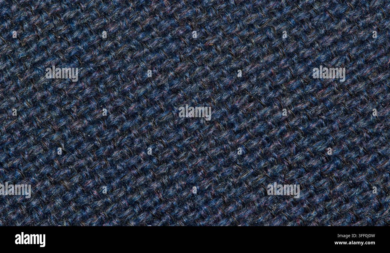 Navyblauer Wollstoffgewebe-Fadenfarbenmuster mit hellen Flecken. Stockfoto