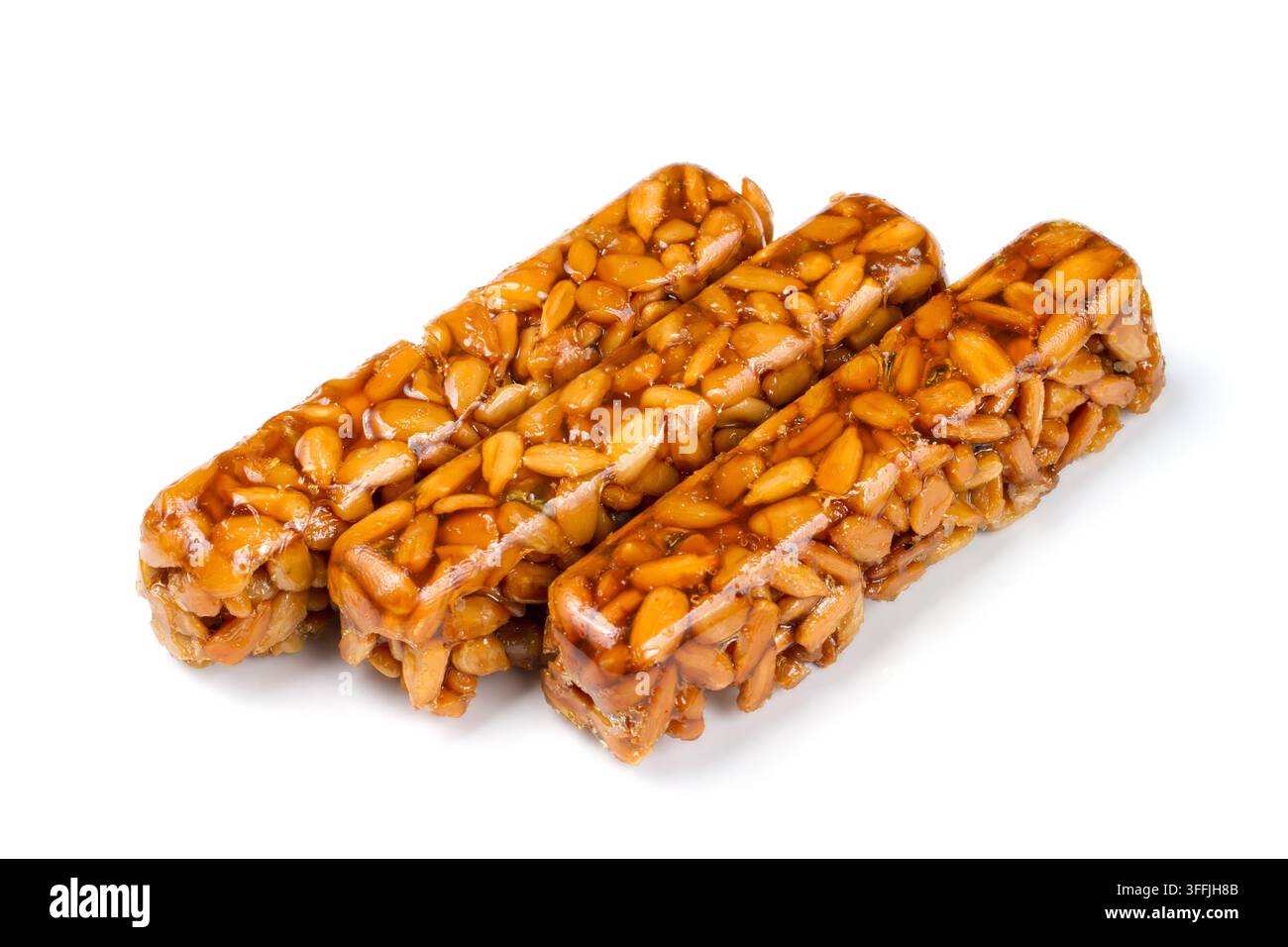 Kozinaki auf weißem Hintergrund. Süßwaren aus Samen. Süße Kozinaki. Stockfoto