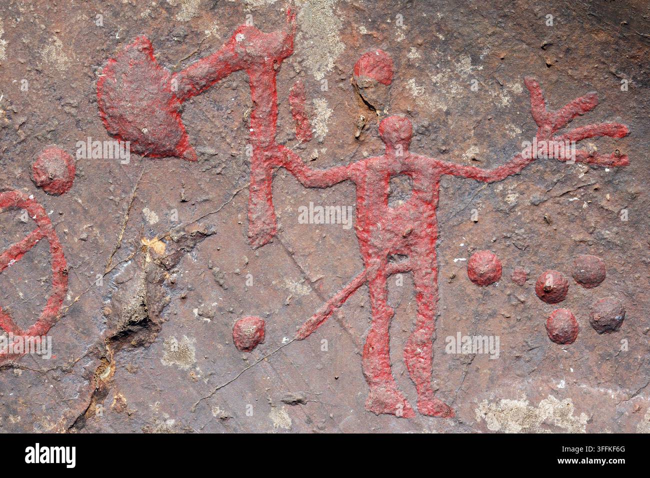 Axman-Petroglyphen auf einem Felsen Stockfoto
