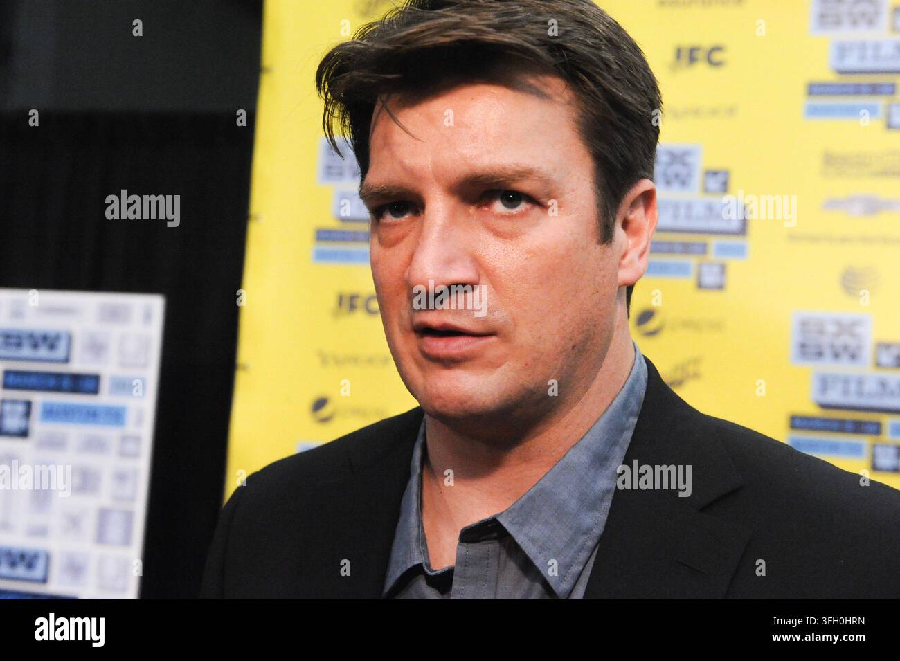 Nathan Fillion bei einer Vorführung von 'Viel Lärm um nichts' in Austin, Texas, am 10. März 2013. (Foto von John Anderson/The Austin Chronicle) Stockfoto