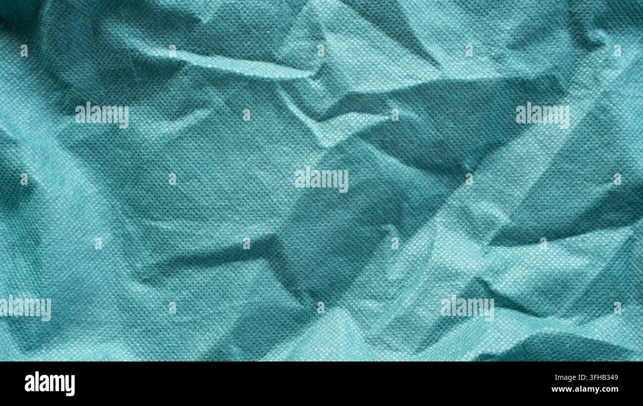 Zerknitterte tealgrüne Vliesstofftextur abstrakter Hintergrund Stockfoto