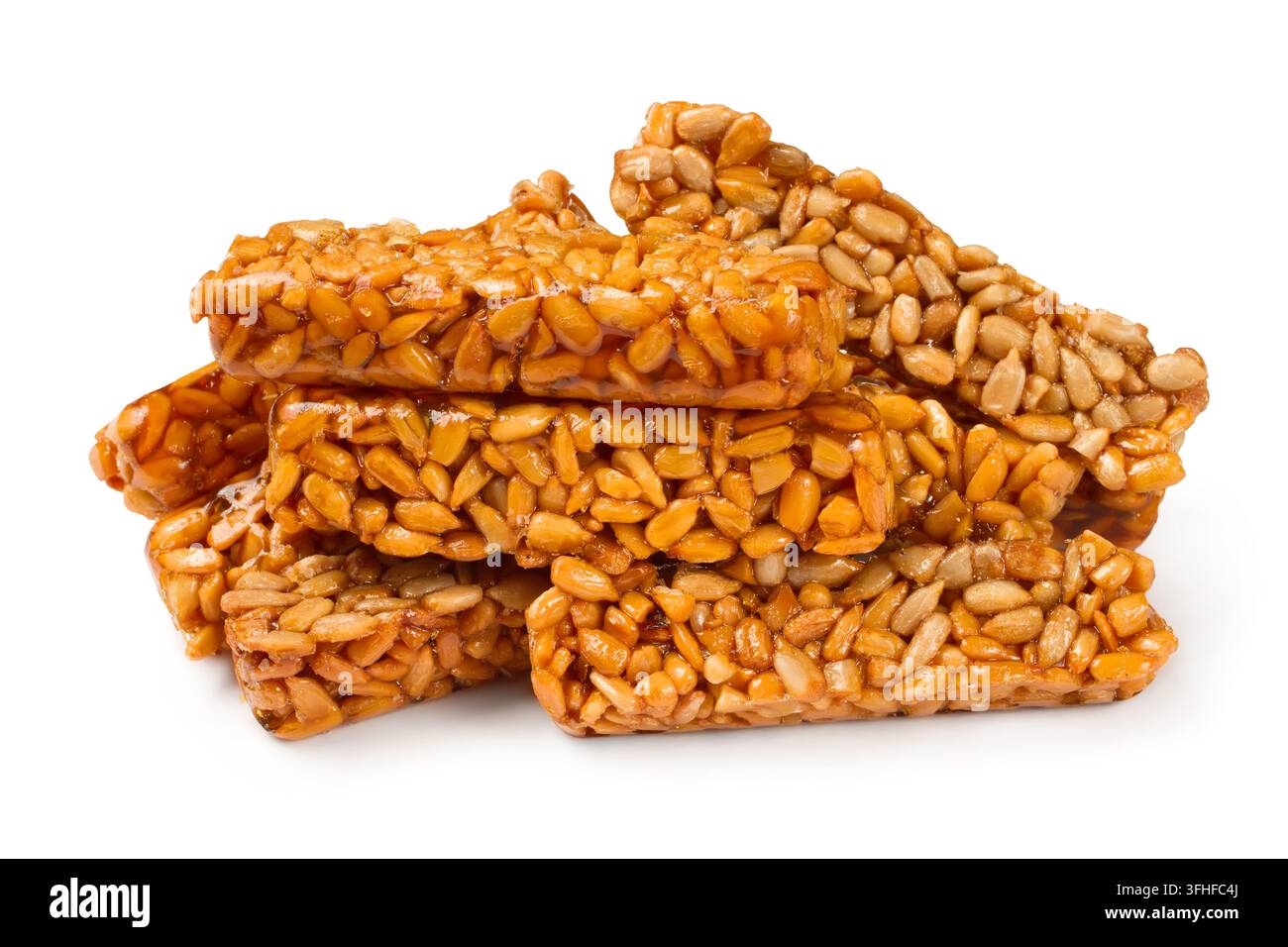 Süße Kozinaki aus Sonnenblumenkernen. Kozinaki auf weißem Hintergrund. Nahaufnahme von Süßwaren. Stockfoto