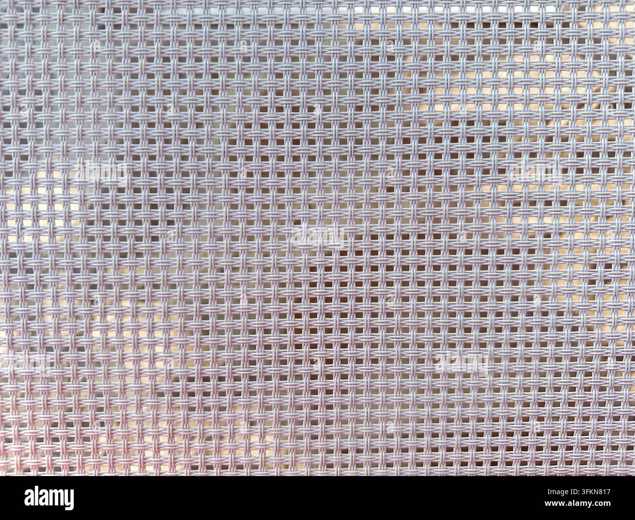 Detaillierte Makroaufnahme einer gewebten synthetischen Mesh-Materialoberfläche. Stockfoto