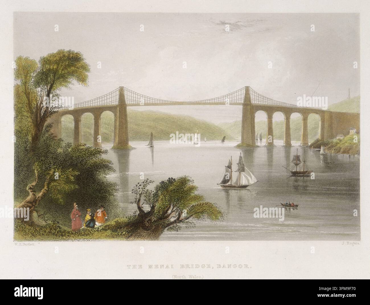 Eine handkolorierte Radierung von William Henry Bartlett (1809–1854) und J. Rogers, die die Menai-Hängebrücke in Bangor, Nordwales, darstellt. Entworfen von Thomas Telford (1757–1834) und 1826 fertiggestellt, war die Brücke eine bahnbrechende Ingenieursleistung, die Postkutschen auf der Straße zwischen London und Holyhead transportieren sollte. Diese Ansicht, veröffentlicht von George Virtue für William Findens The Ports, Harbours, Watering-Places and Coast Scenery of Great Britain, zeigt mehrere Segelboote und ein Ruderboot, die die Menai-Straße unter den Hängespannweiten befahren. c.1841. Stockfoto