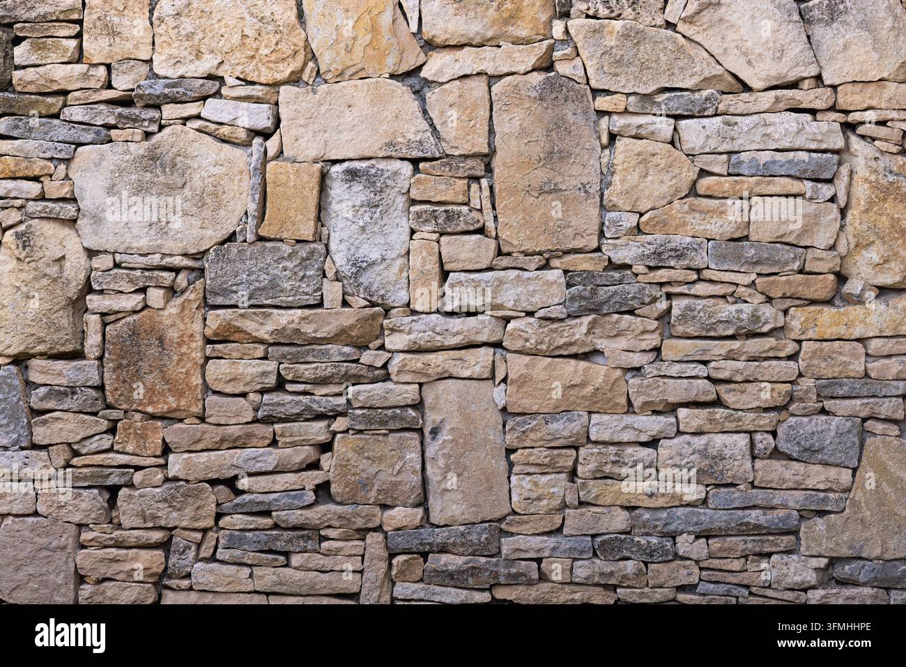 Alte rustikale Steinmauer-Textur-Hintergrund Stockfoto