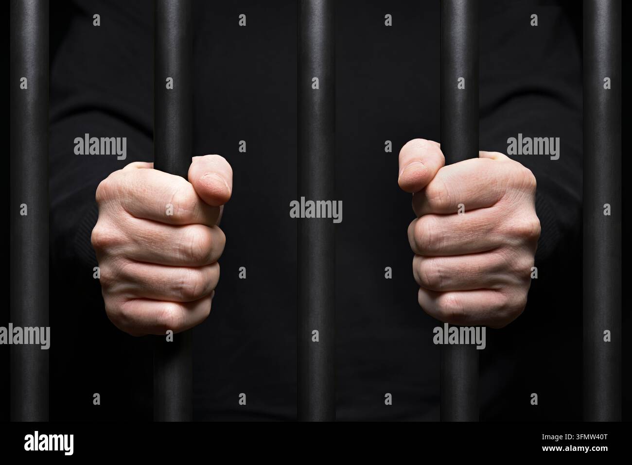 Gefangener hinter Gittern. Nahaufnahme Stockfoto