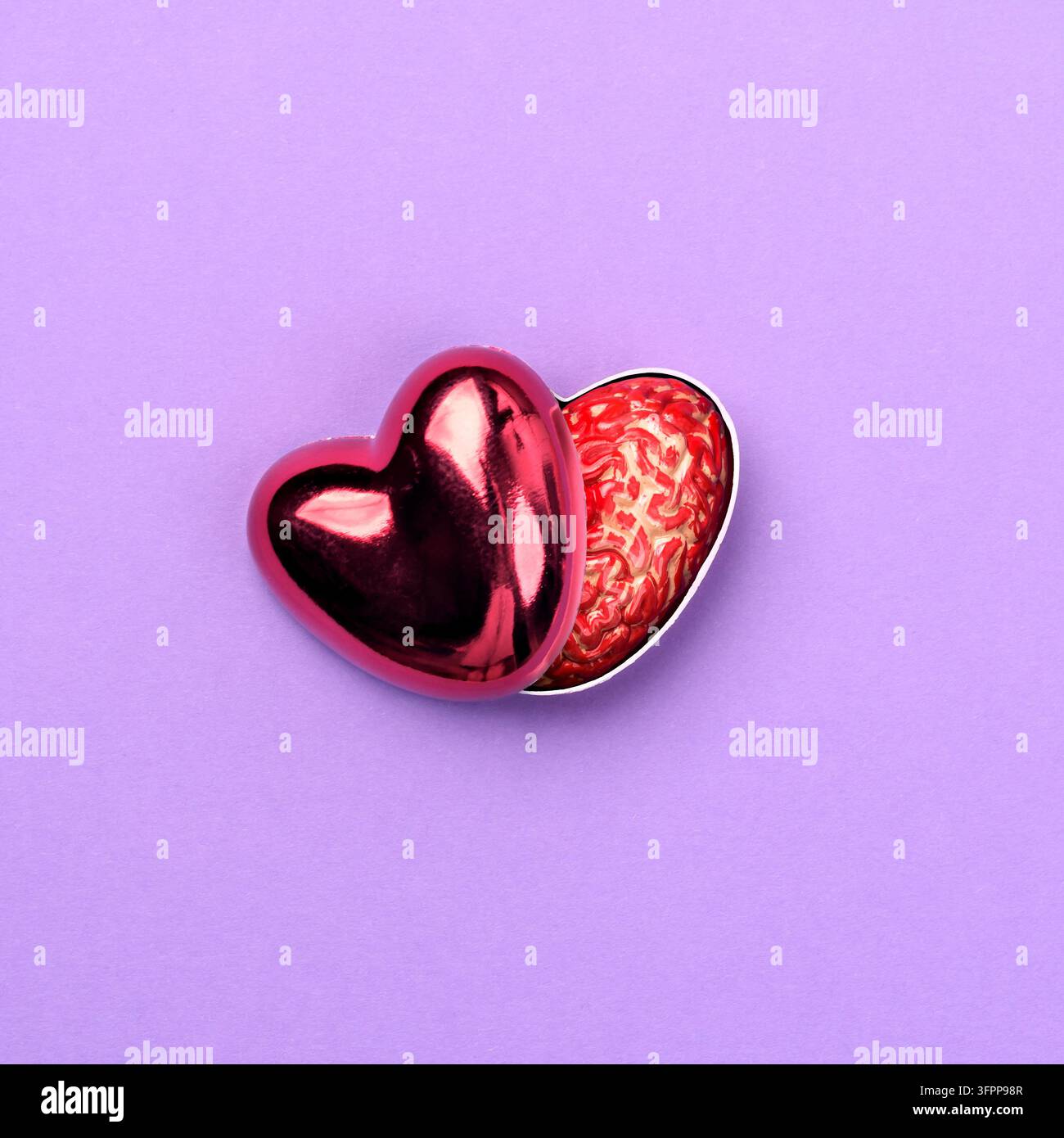 Glänzendes rotes Herz, das aufgespalten ist, um ein menschliches Gehirn zu enthüllen, symbolisiert Selbstliebe, psychische Gesundheit und emotionales Bewusstsein. Stockfoto