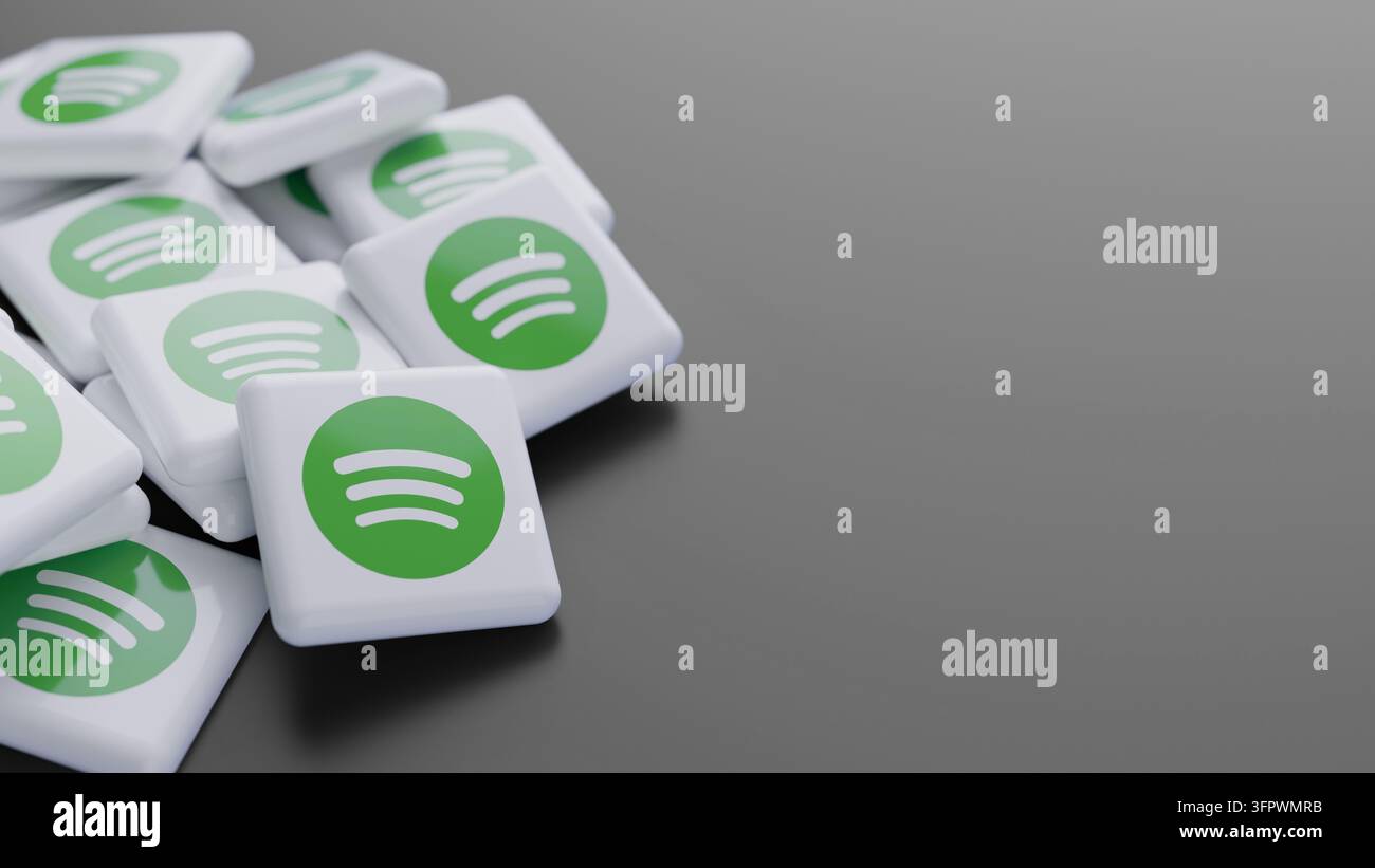 Logo der Musik-Streaming-Plattform Spotify in einem großen Stapel auf grauem Hintergrund mit Platz für Text als Web-Banner-Kopf Stockfoto