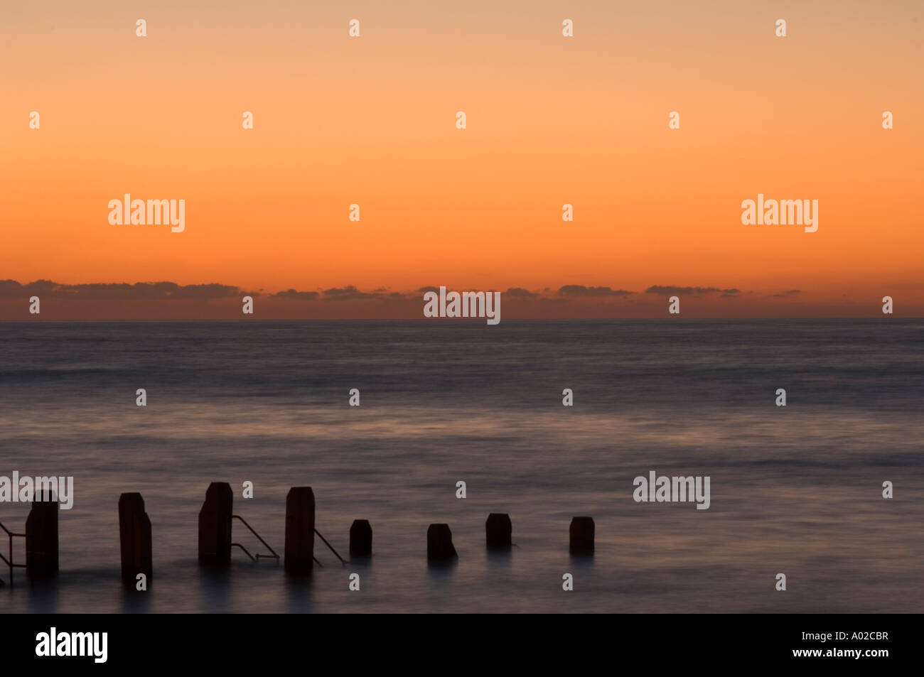hölzerne Steg Aberystwyth Ceredigion Caridigan Bay Westküste Wales Sonnenuntergang Sommer Abend Sonnenuntergang UK Stockfoto