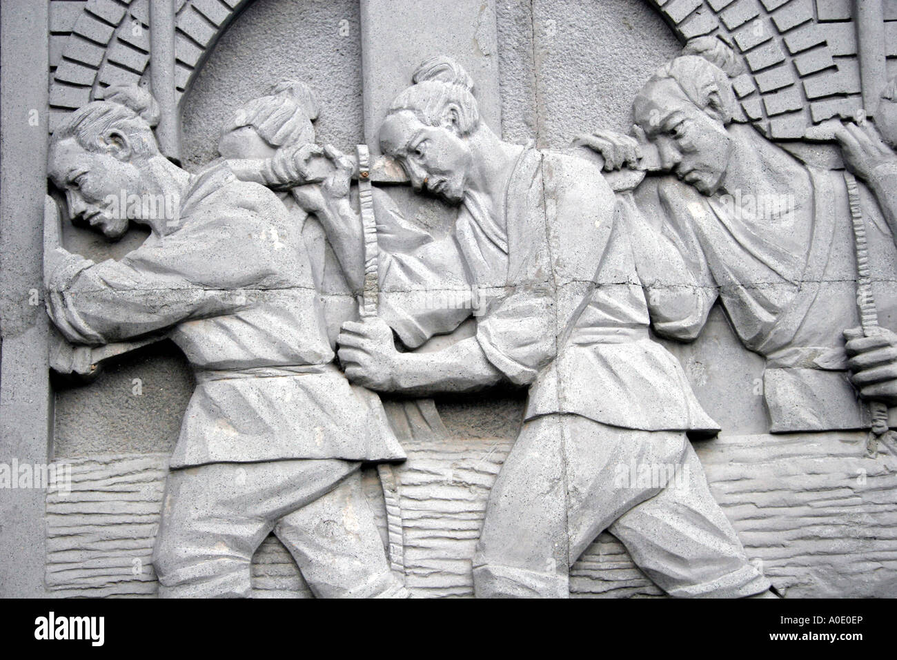 Bass Reliefs Darstellung Szenen aus der Kulturrevolution. Stockfoto
