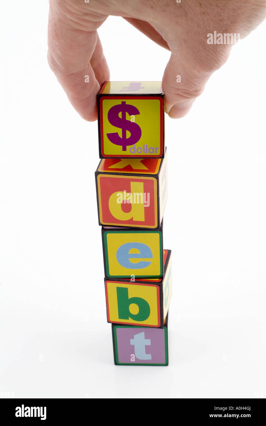Spielzeug Bausteine mit dem Wort Schulden und das Dollar-symbol Stockfoto